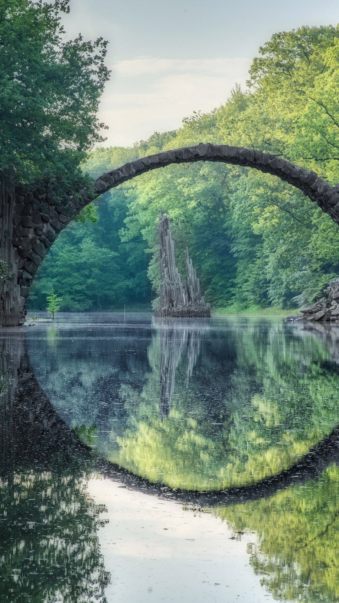 1080x1920 Arched Devil's Bridge (Rakotzbrucke) in summer, Kromlau, Germany. Windows Spotlight Image