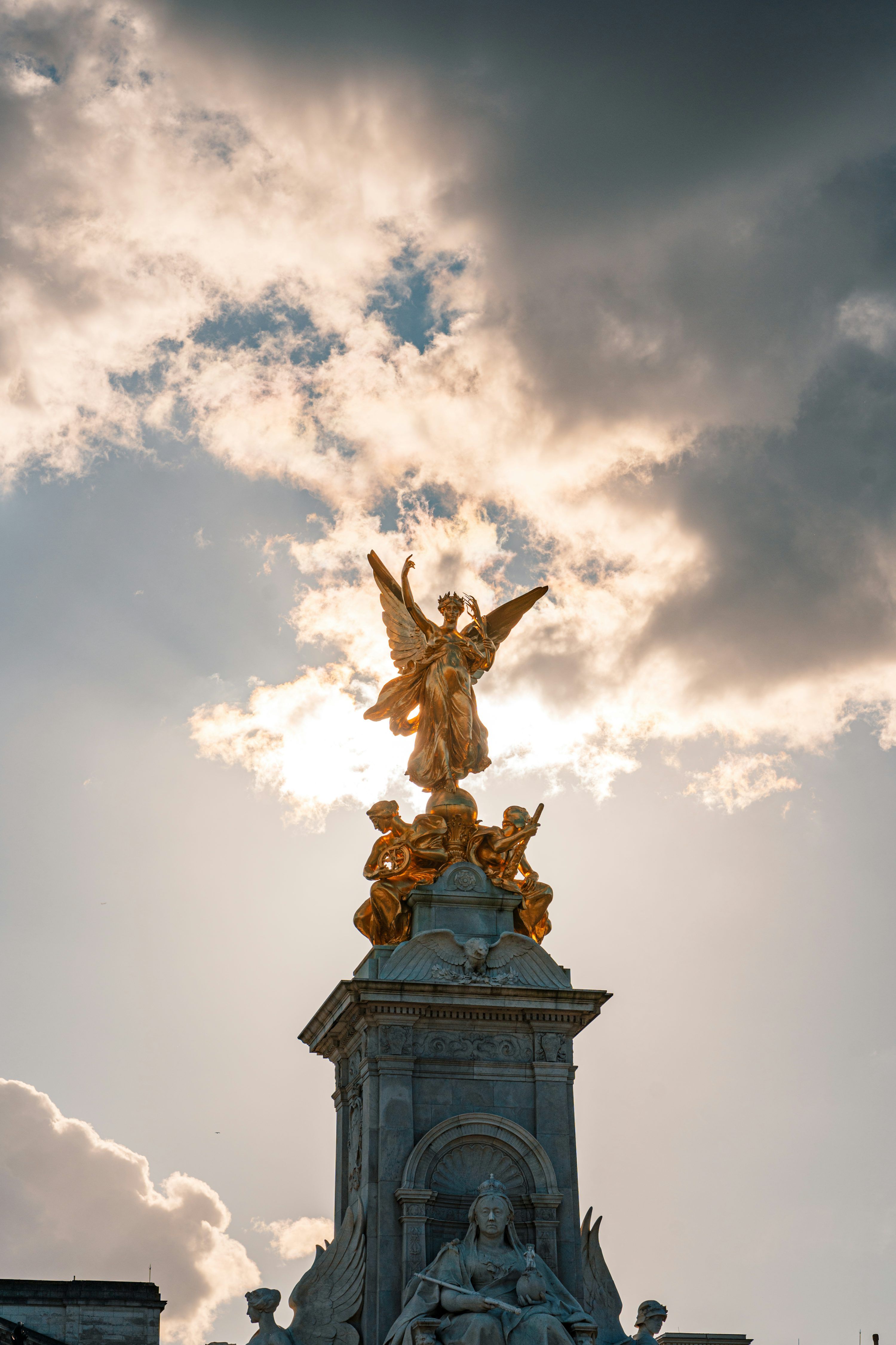 3000x4500 A statue of an angel on top of a building photo