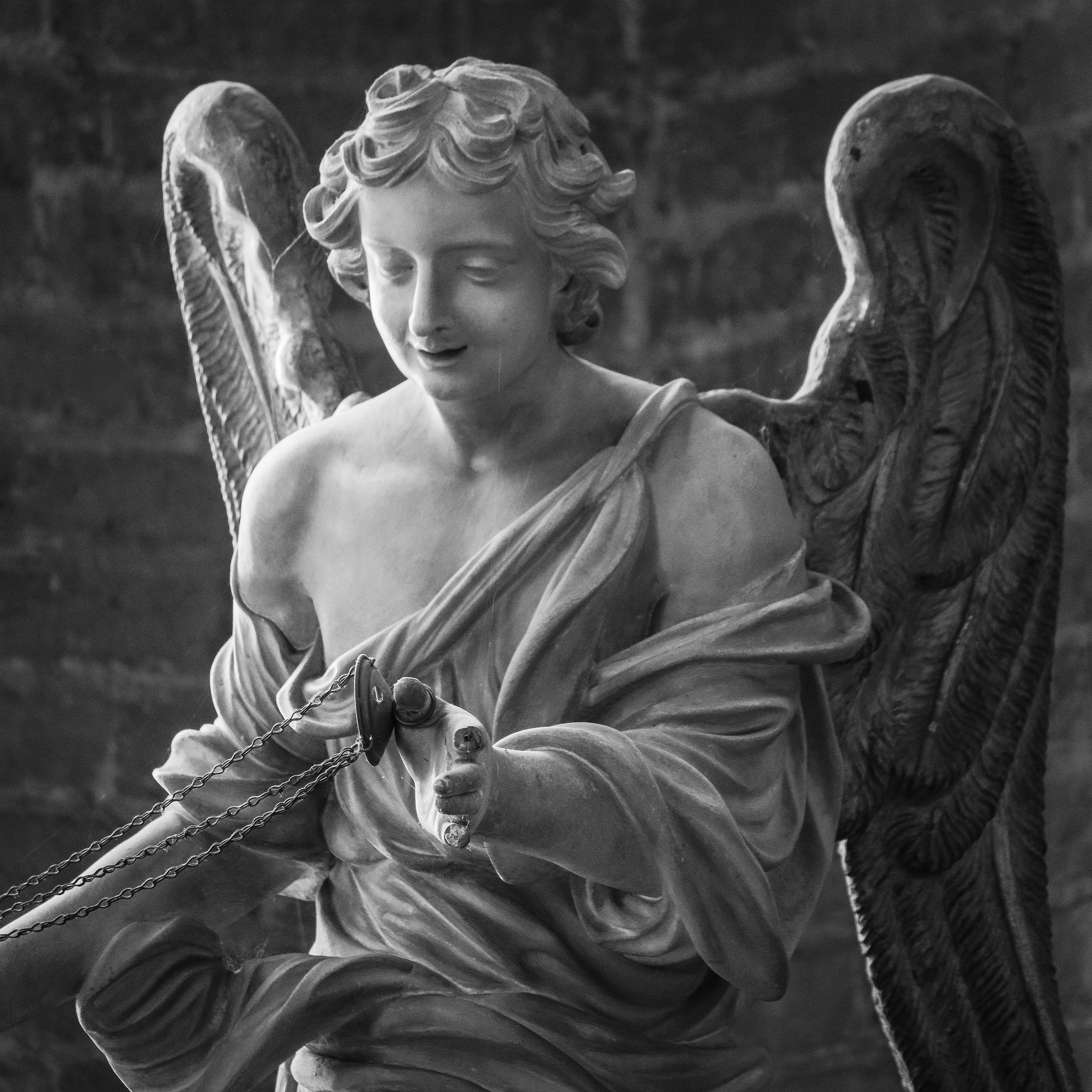 3000x3000 Stone angel sculpture with feathered wings photo