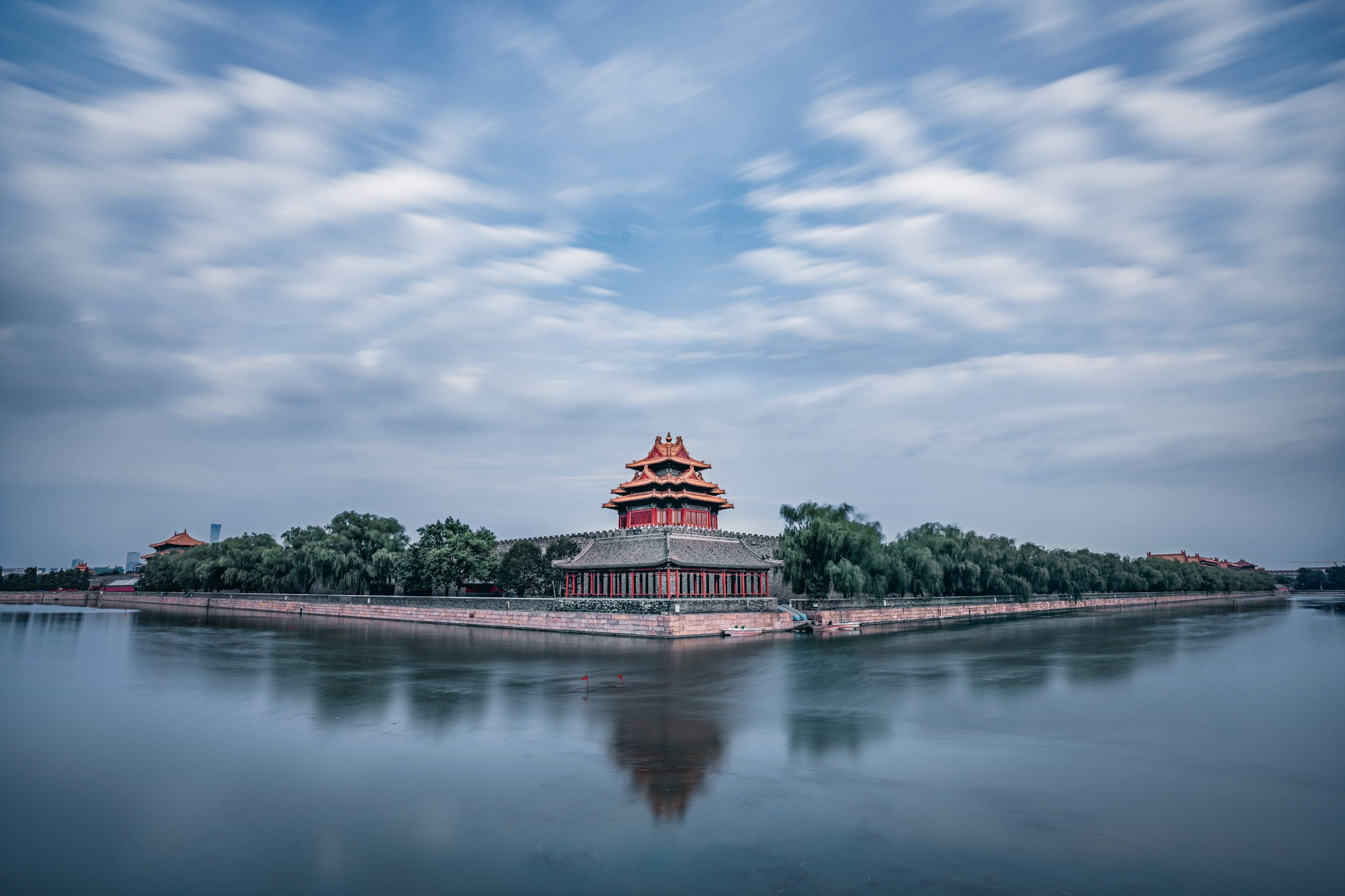 3000x2000 Red and white temple near green trees and lake under blue sky and white clouds during photo