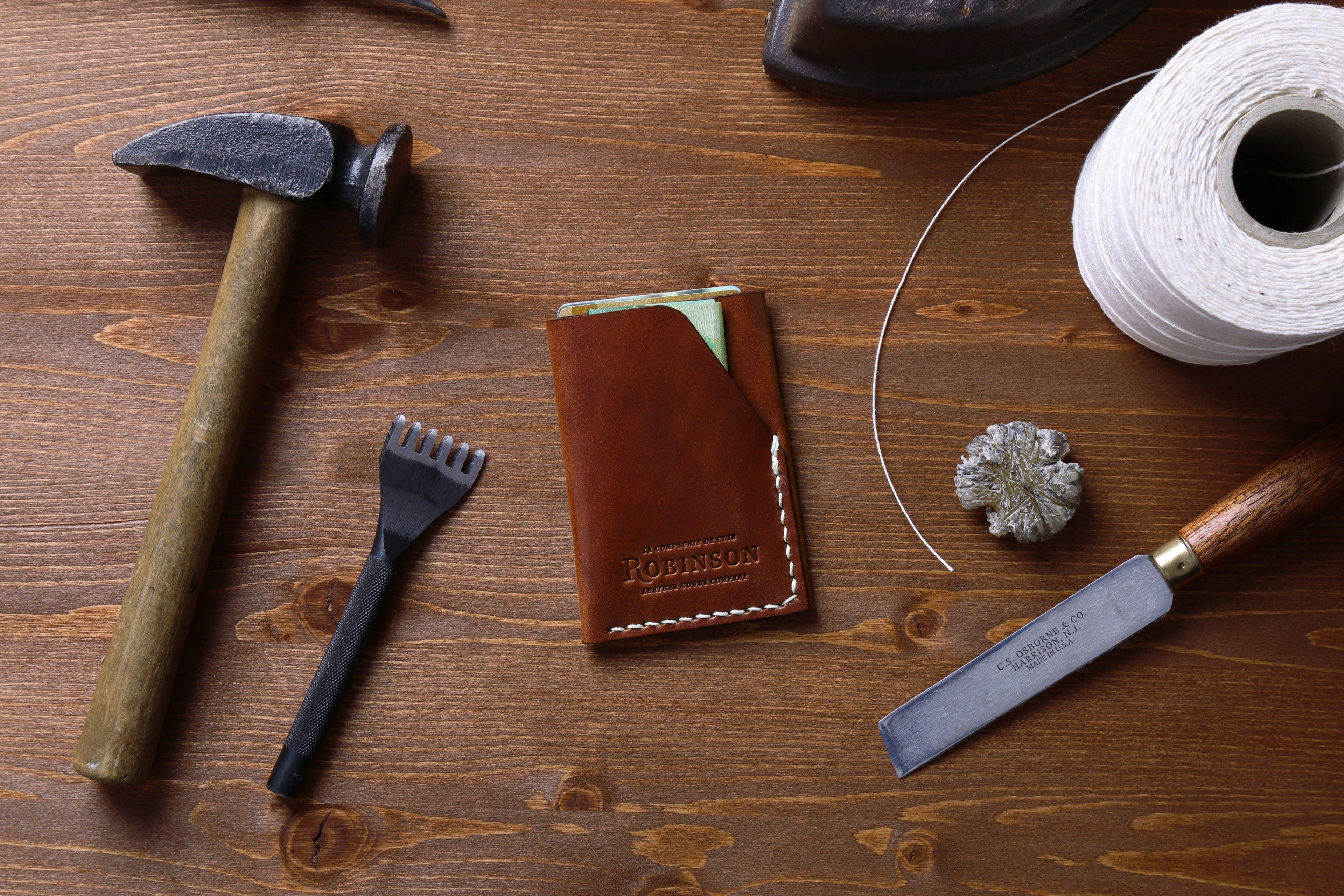 3840x2560 Wallpaper / an overhead shot of a leather document sleeve among various tools on a wooden surface, slim wallet handcrafted 4k wallpaper