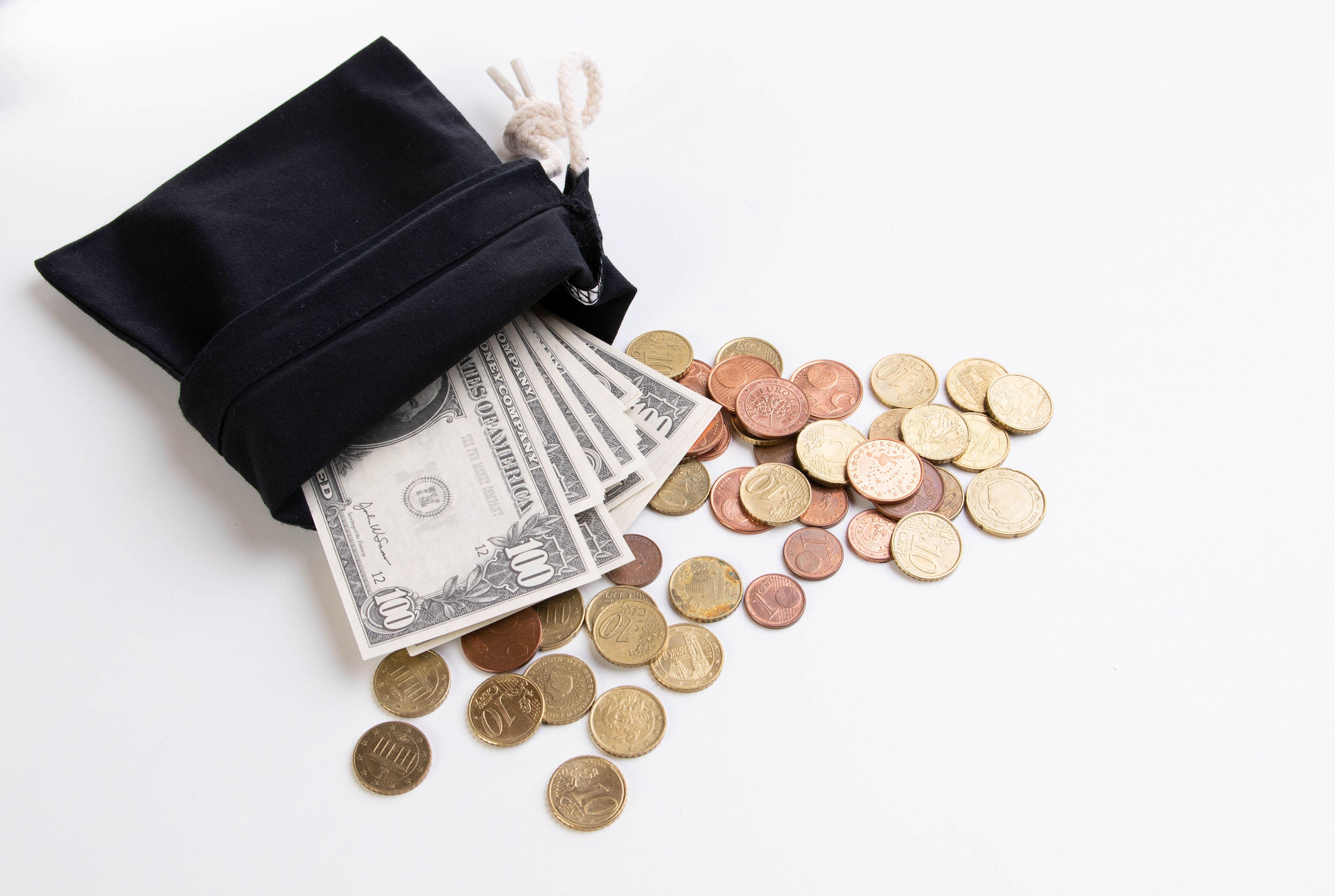 4640x3115 Wallet with coins and dollars on a white background wallpaper and image, picture, photo