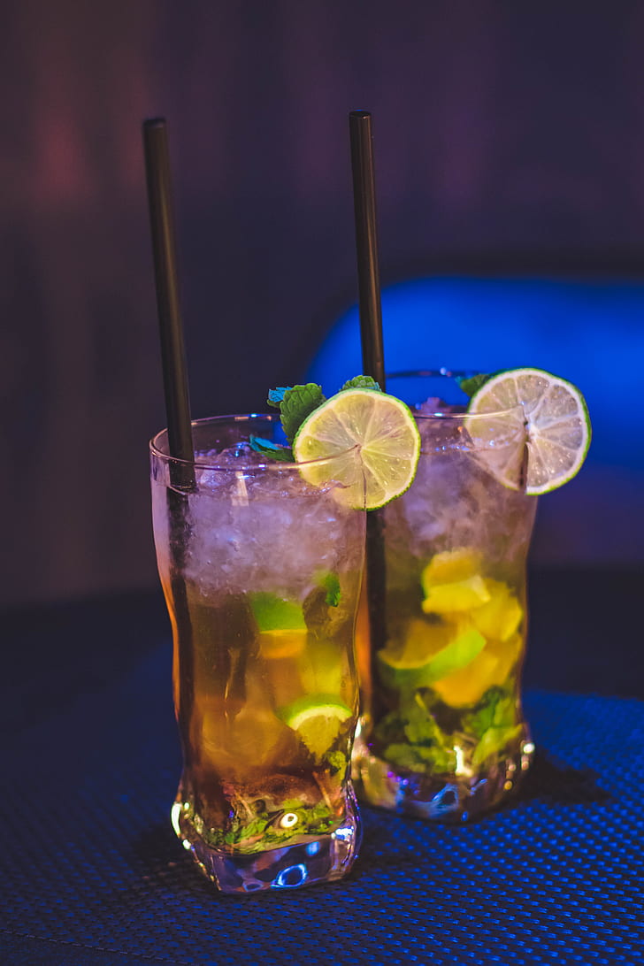728x1092 Royalty Free Photo: Two Clear Drinking Glass With Juice And Black Straw