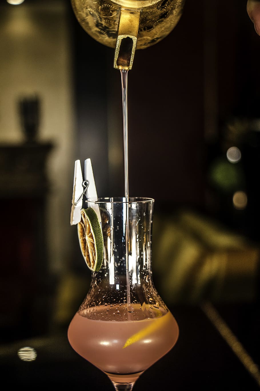 910x1365 HD wallpaper: person pouring fruit juice on glass, cocktail, drink, alcohol