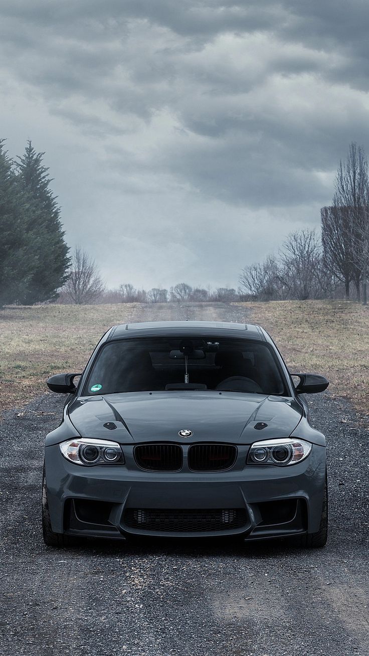736x1308 BMW Car Parked Under Dark Cloudy Sky. Серии бмв, Спортивные автомобили, Обои
