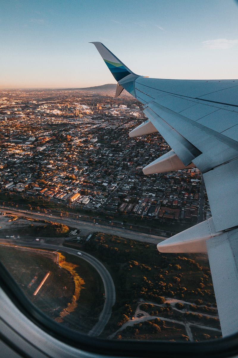 800x1200 Airplane, wing, city, aerial view, overview, HD phone wallpaper