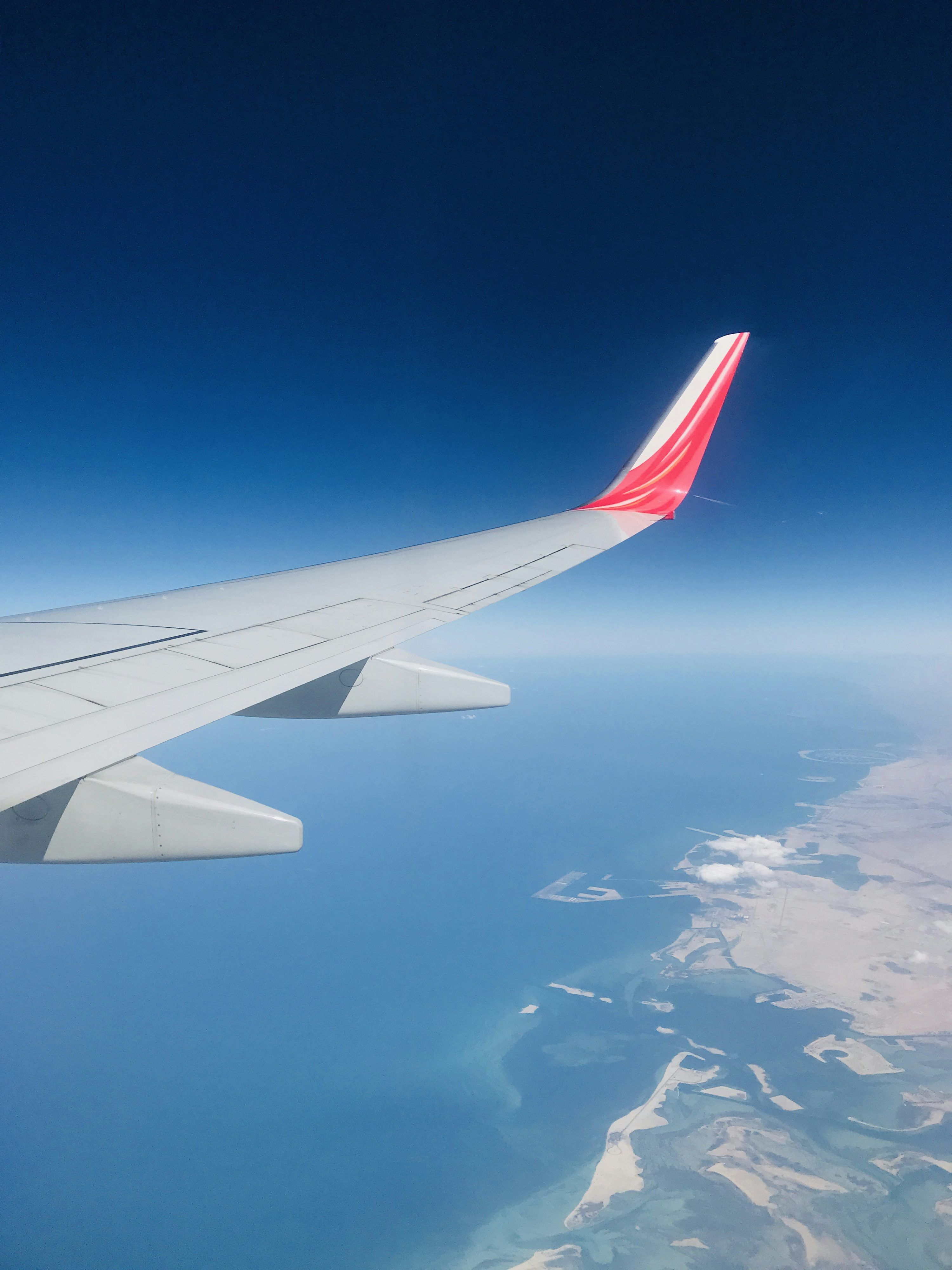 3000x4000 White and red airplane wing photo