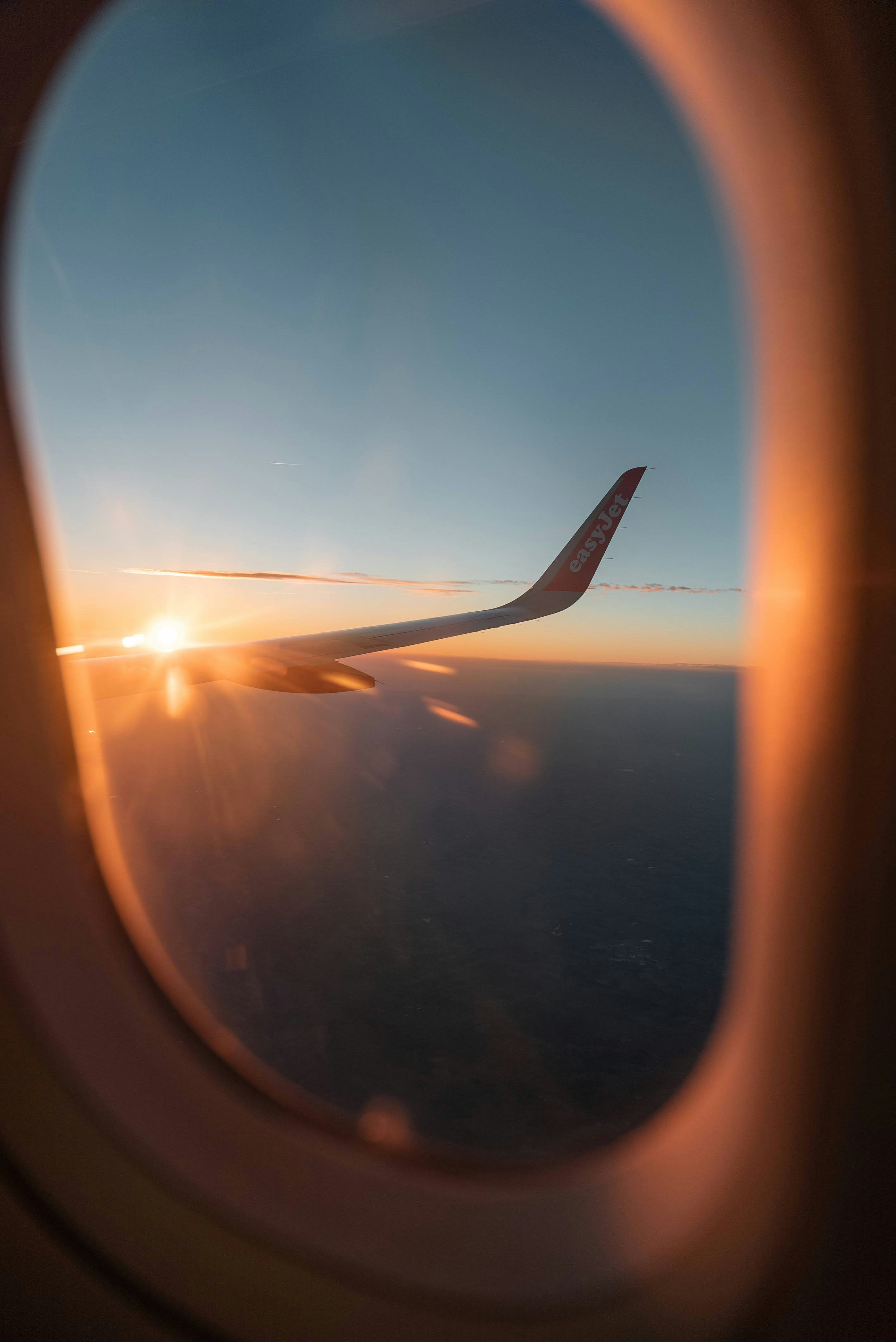 3000x4492 A view of the sun through an airplane window photo