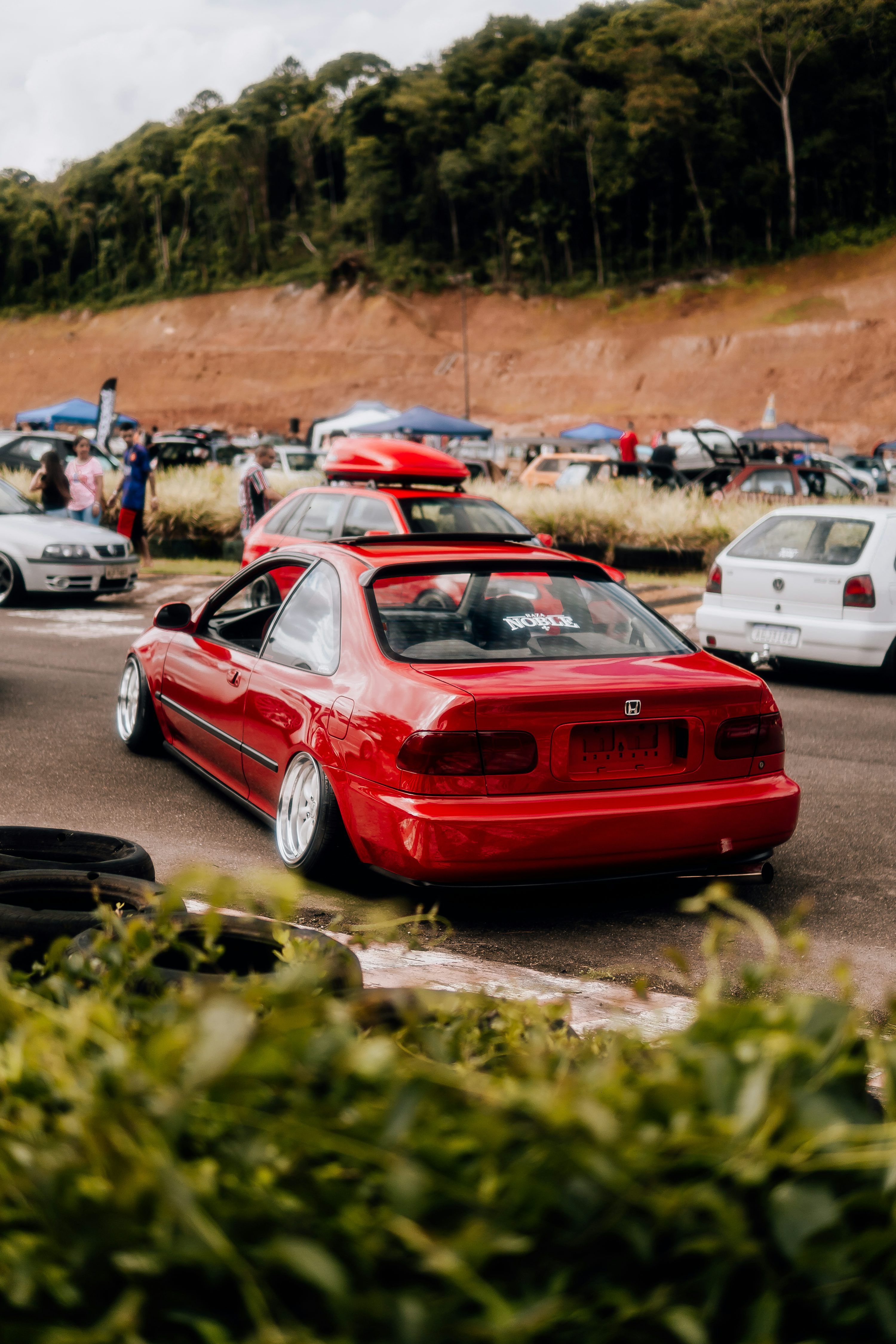 3000x4500 A group of cars parked in a parking lot photo