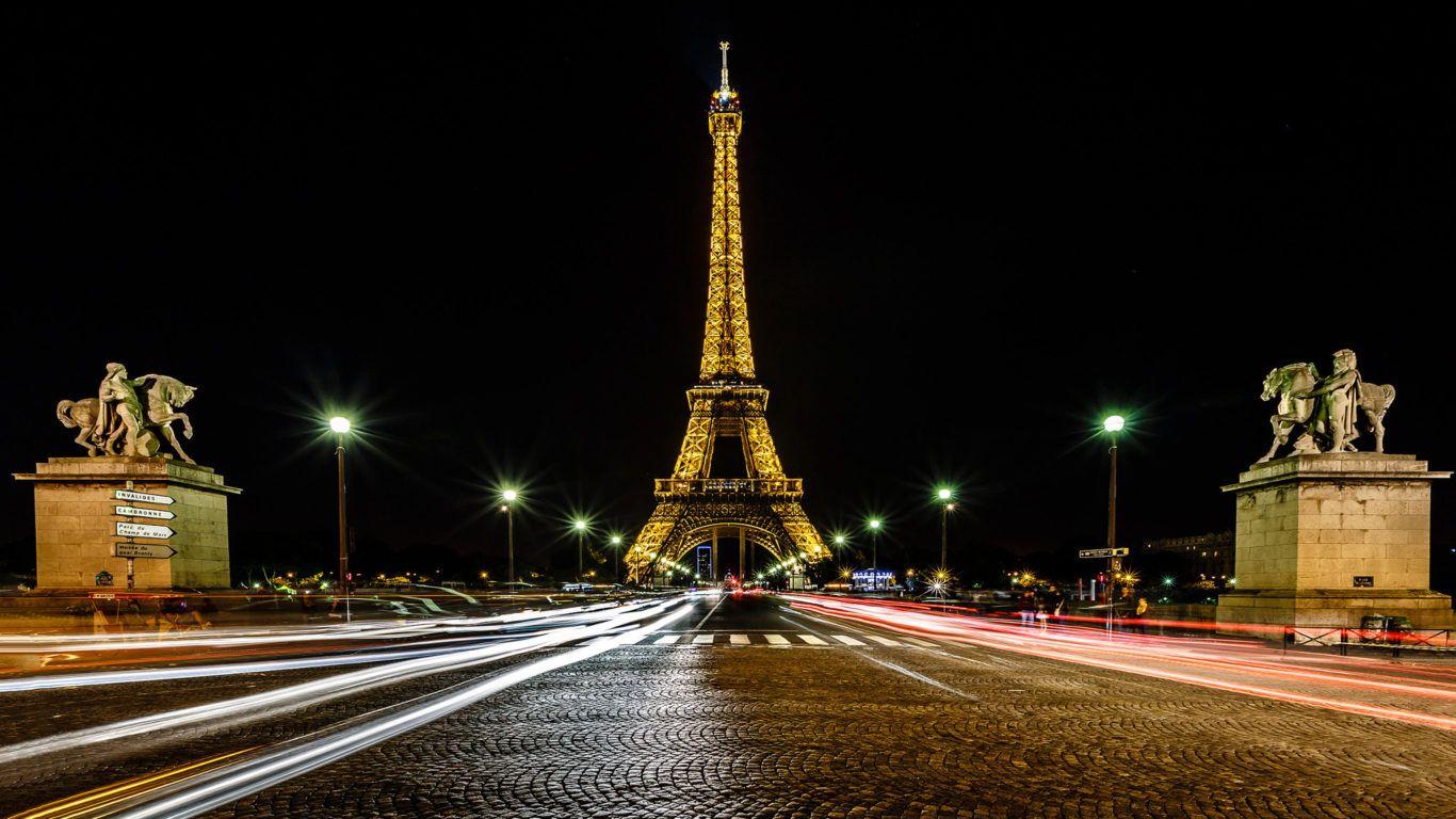 1366x768 France Eiffel Tower Paris Traffic Trails And Street Lights In The Night Ultra HD Desktop Wallpaper For Computers Laptop Tablet And Mobile Phones :