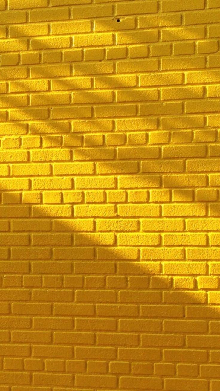 736x1308 Yellow brick wall with beautiful lighting. Yellow wallpaper, Yellow aesthetic, Colorful wallpaper