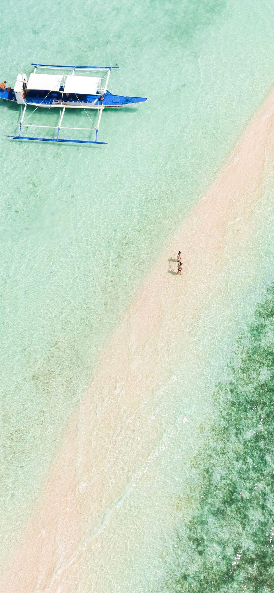 1125x2436 people on beach during daytime iPhone X Wallpaper Free Download