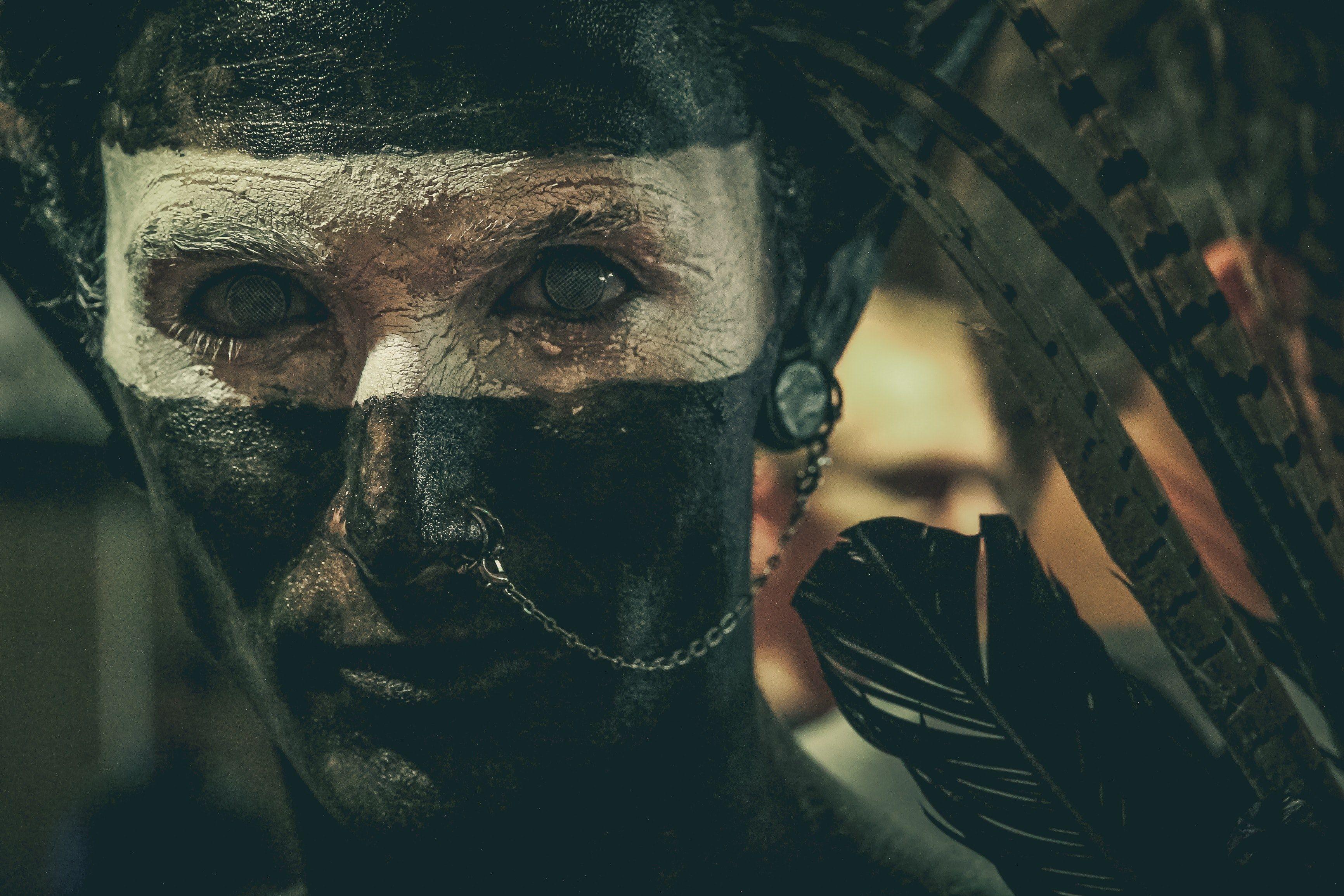 3464x2309 Wallpaper / a man with his face painted black and white, man with tribal face paint 4k wallpaper