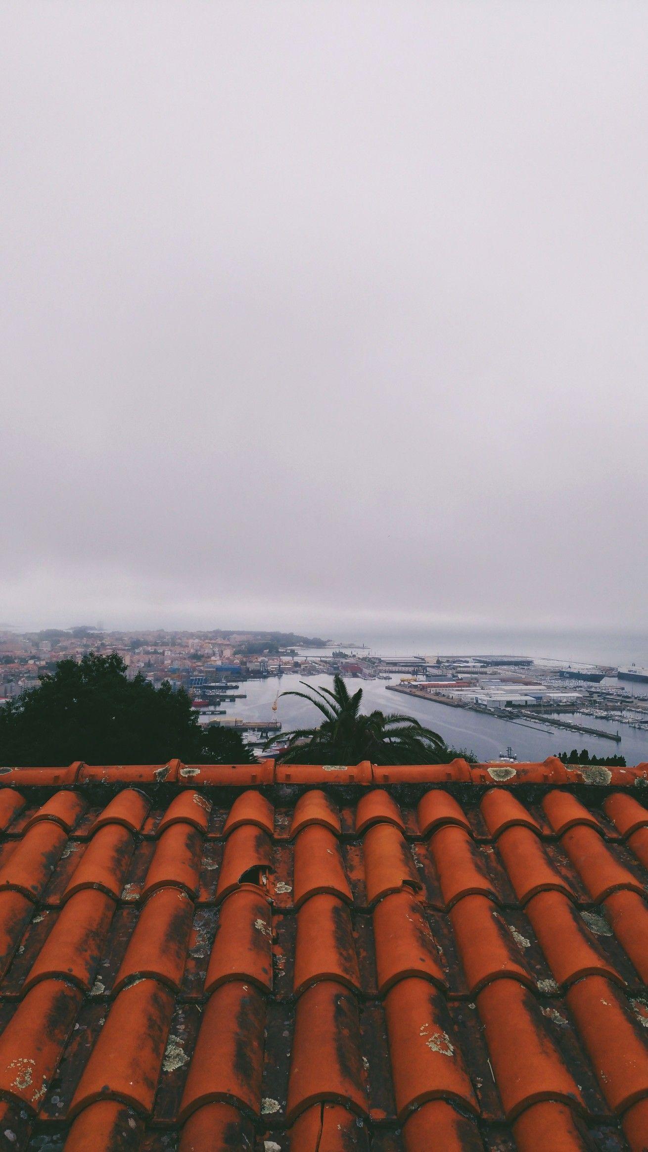 1310x2328 A roof & the sea. Vigo, Galicia, Spain lockscreen