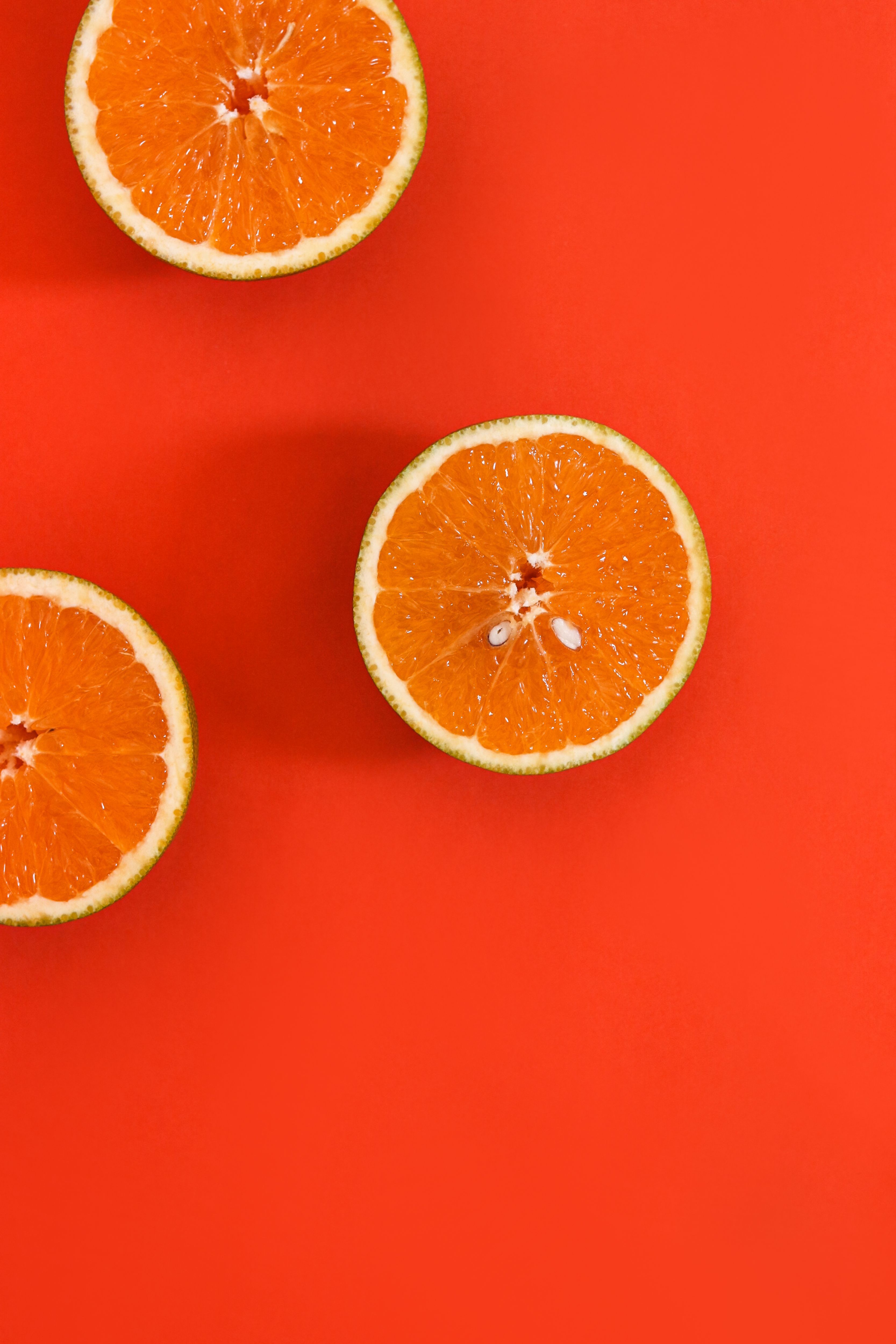 3333x5000 Sliced Orange on Red Surface · Free