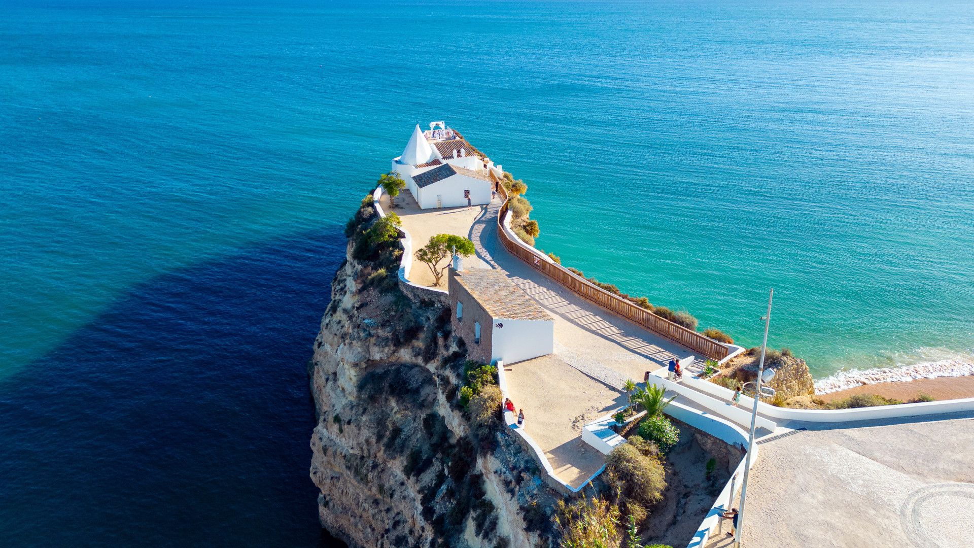 1920x1080 Coast on the Algarve with a small white church / Porches
