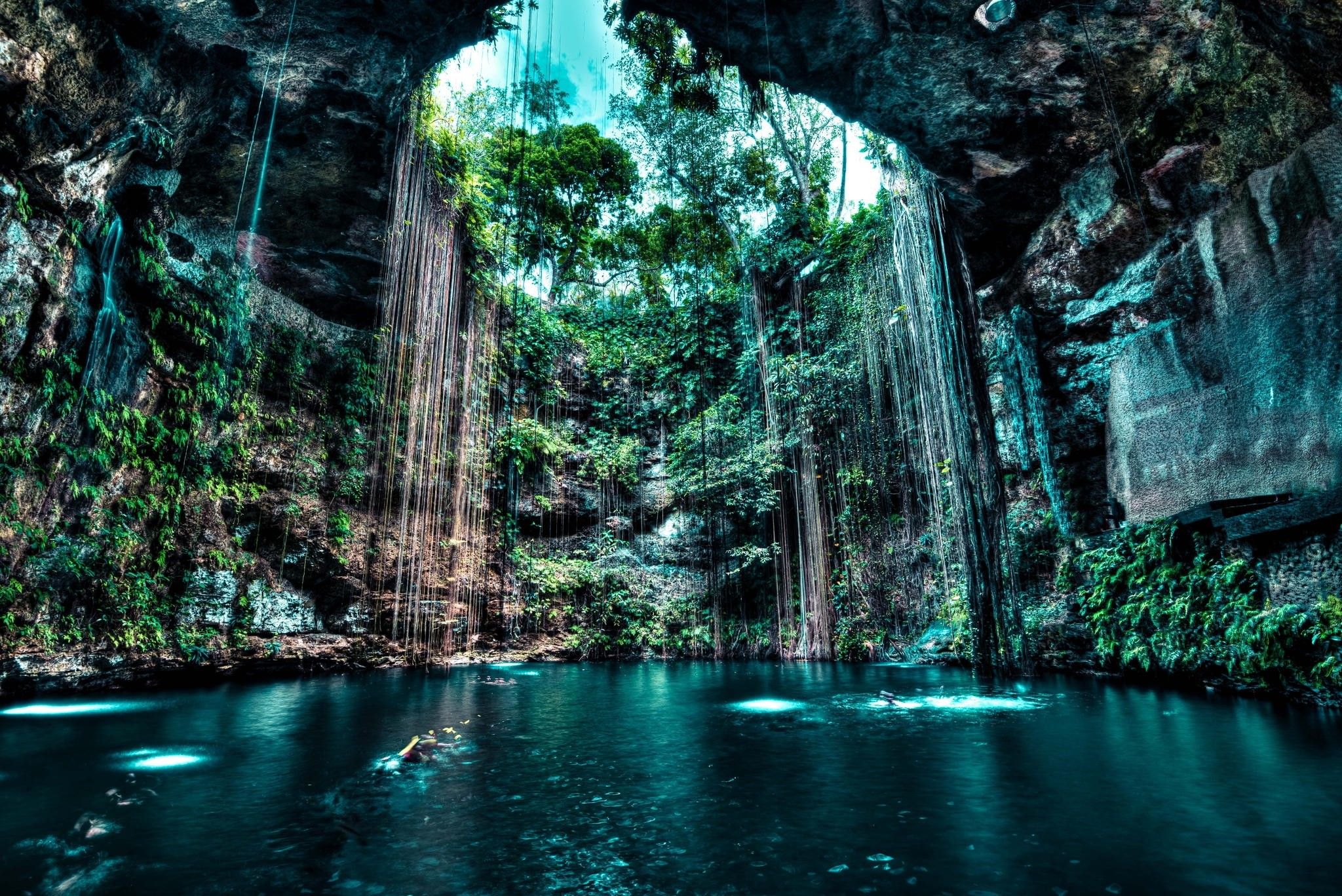 2048x1367 HD Wallpaper: Serene Cliffside Cave with Waterfall and Lush Treesx1367
