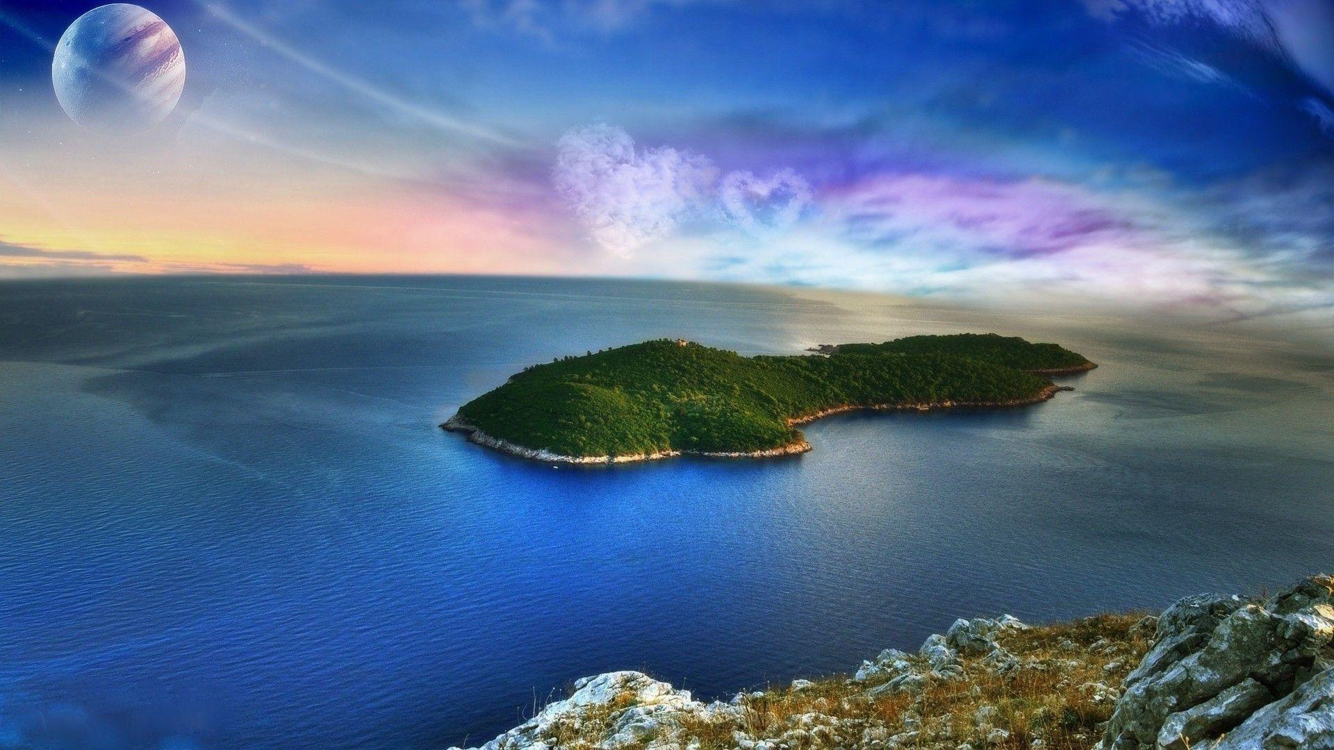 1920x1080 Island in the middle of the ocean and clouds in the shape of a heart
