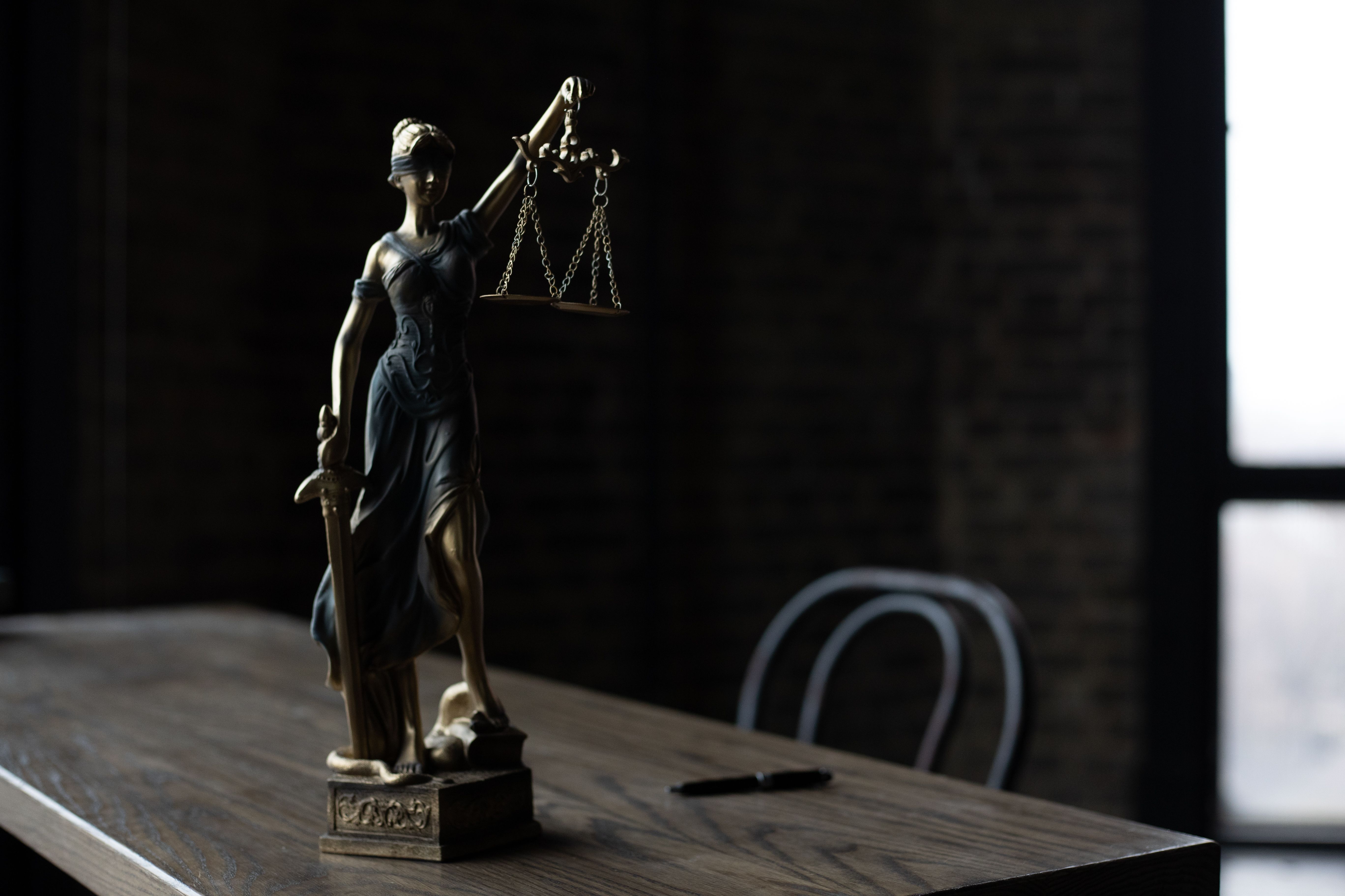 5472x3648 A Figurine of the Lady Justice on a Table · Free