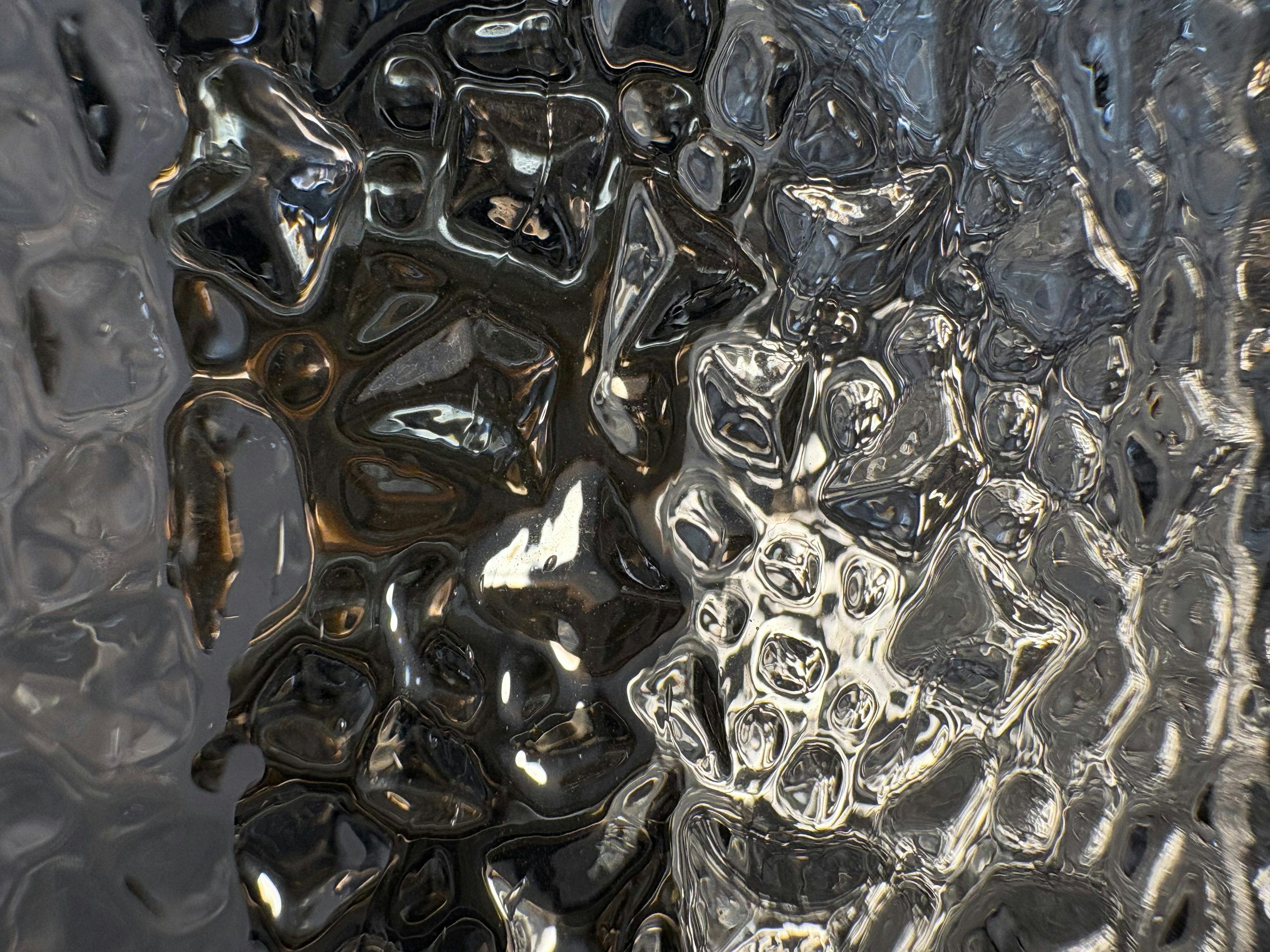3000x2250 Reflective glass with an abstract, wavy design. photo