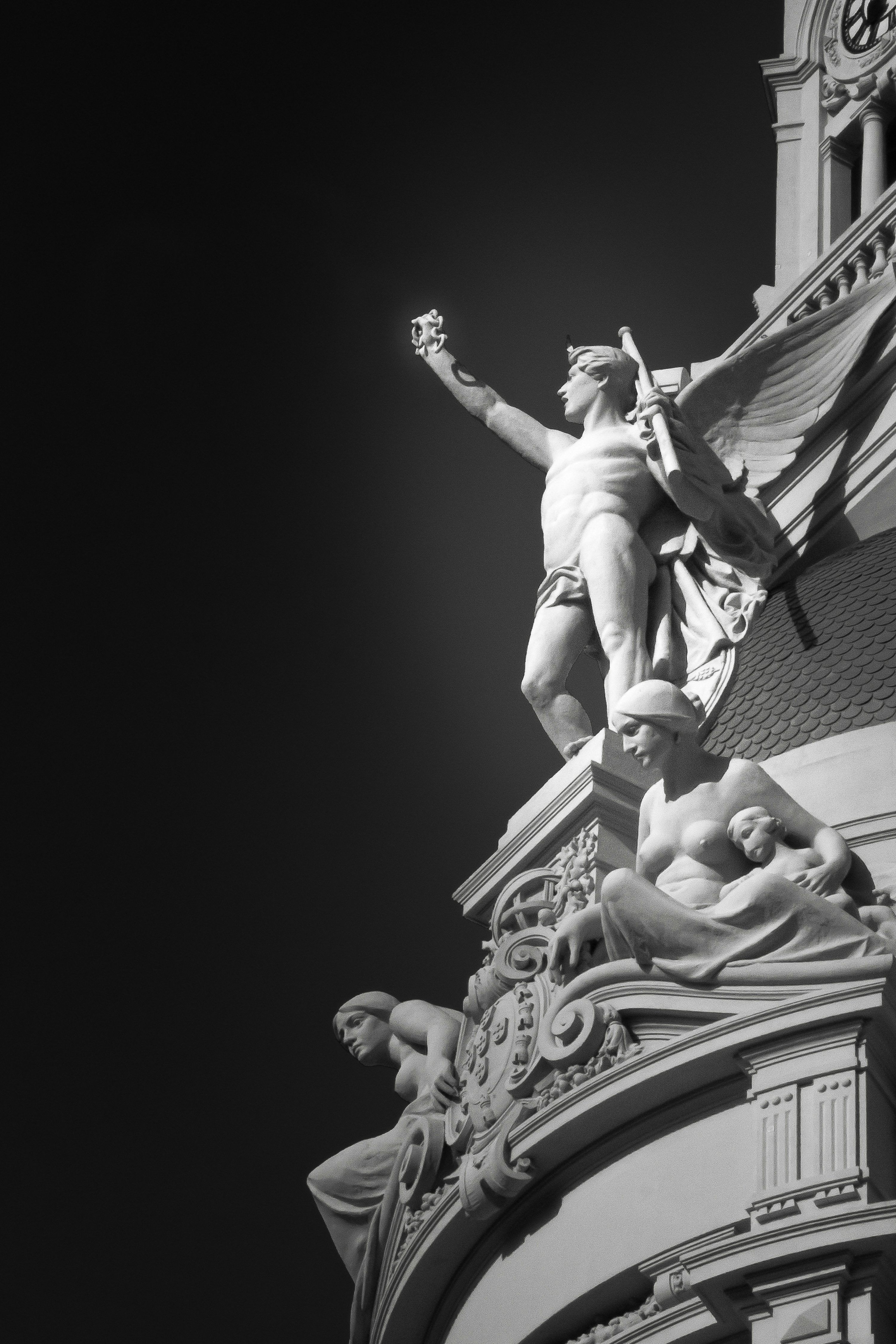 3000x4500 Architectural sculptures stand tall against the dark sky. photo