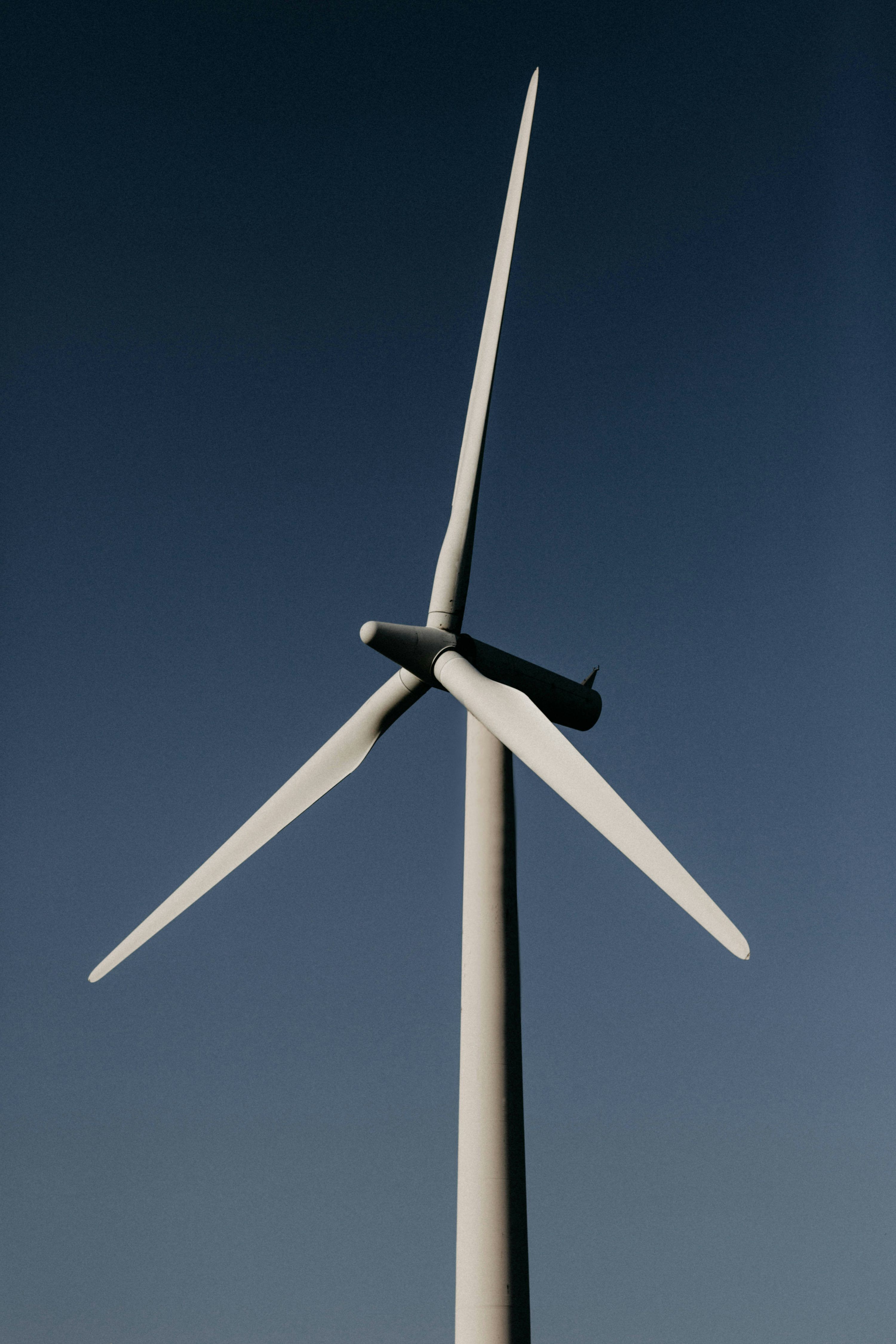 3000x4500 White wind turbine under blue sky during daytime photo