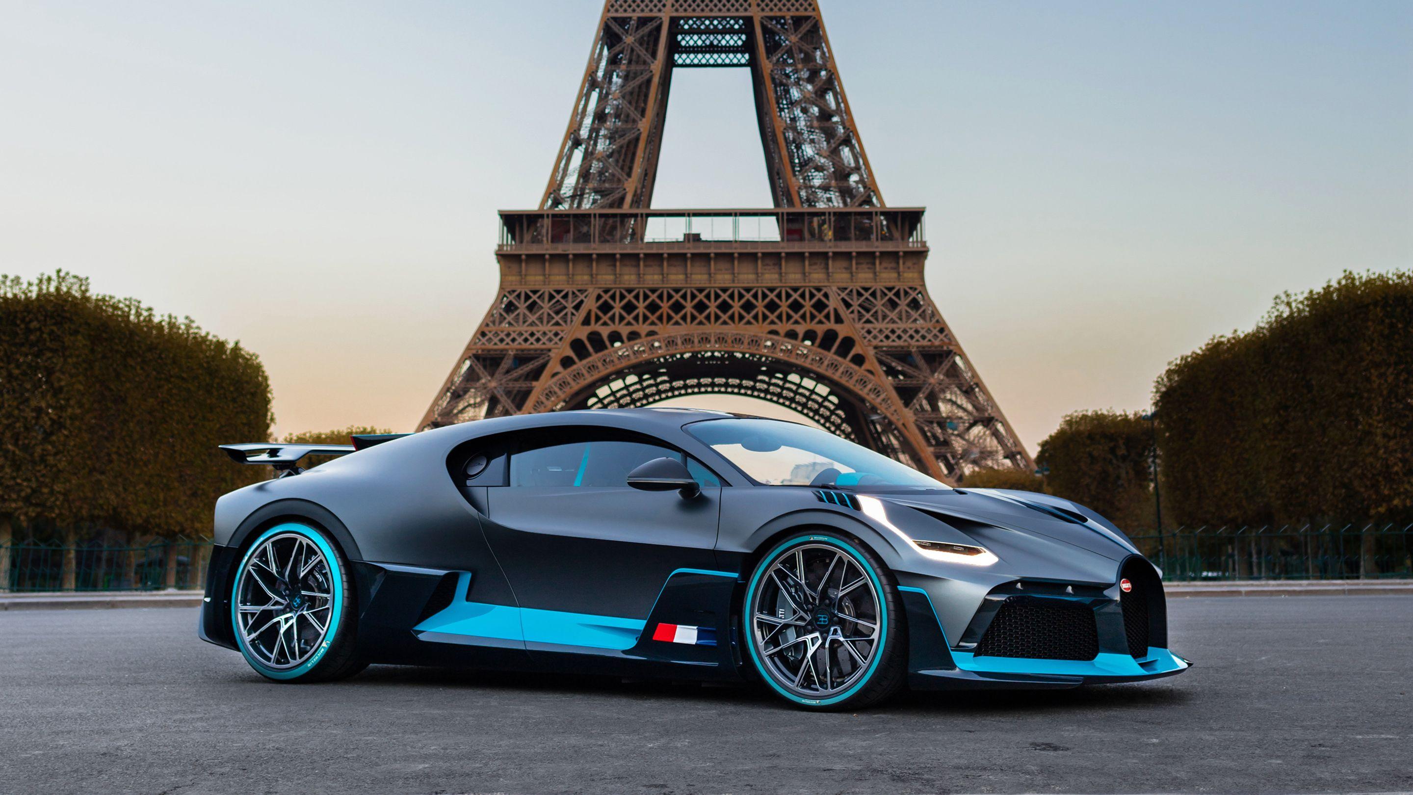 2880x1620 Sports car Bugatti Divo on the background of the Eiffel Tower wallpaper and image, picture, photo