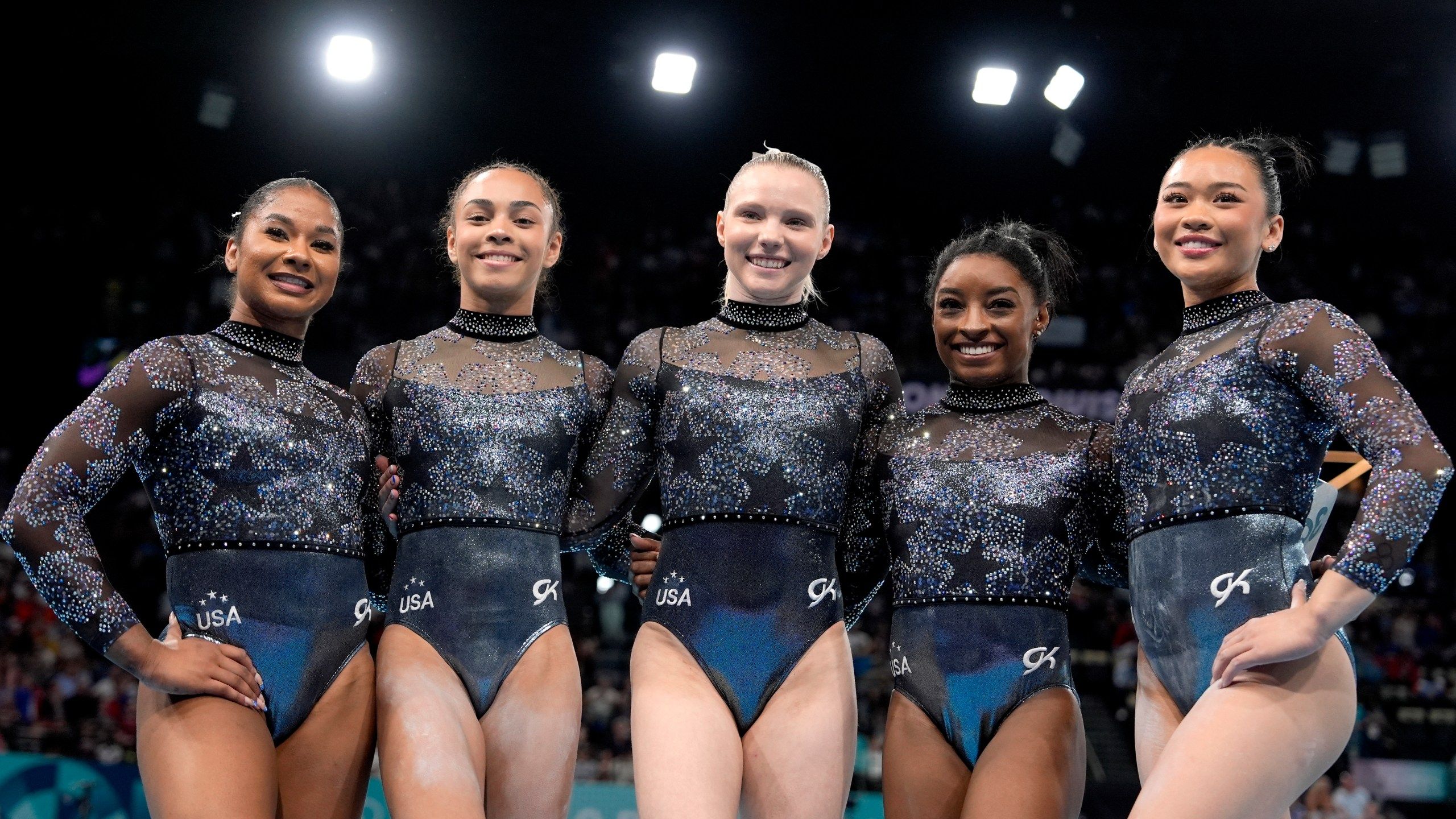2560x1440 The Latest: Simone Biles and Team USA win women's gymnastics team gold