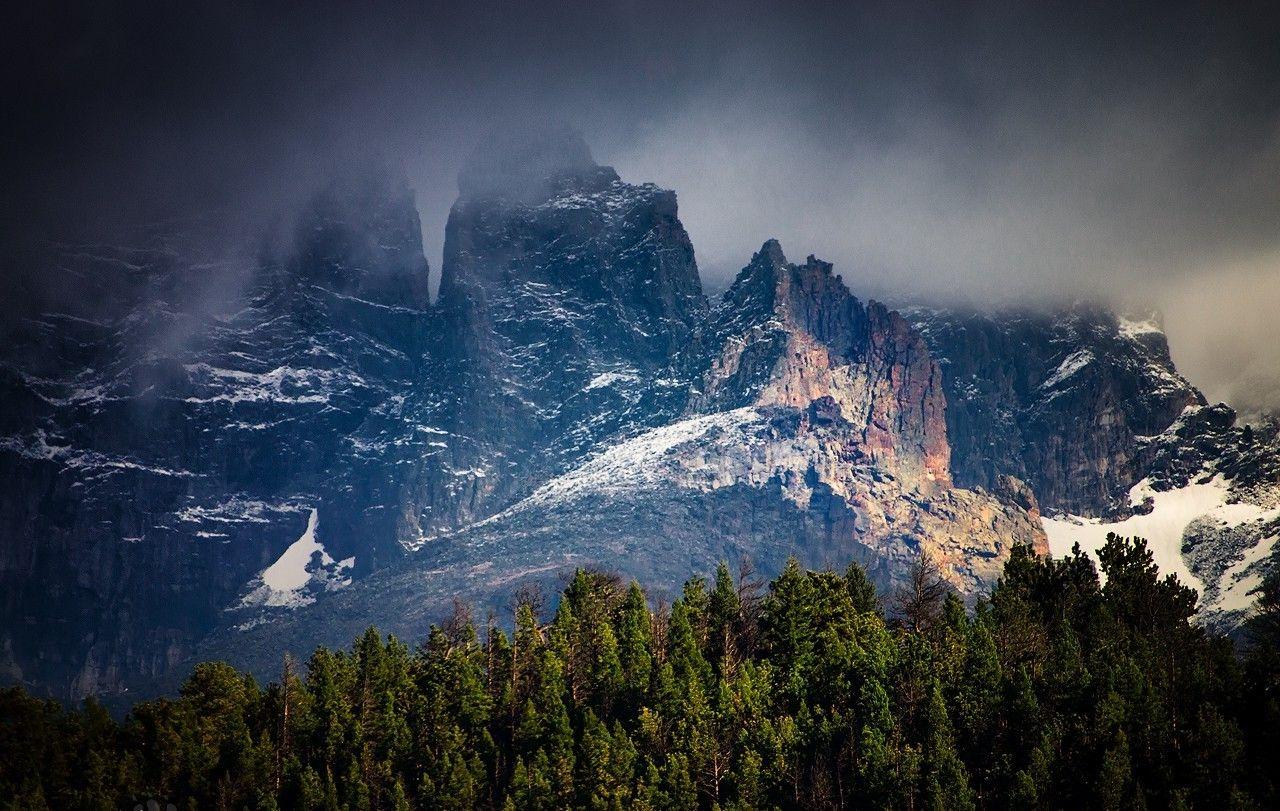 1280x811 nature landscape mountains forest snow storm dark clouds trees cliff