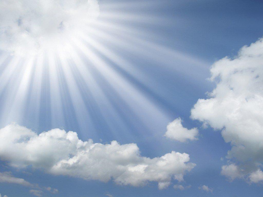1024x768 Sun Rays Coming Out Of The Clouds Background For PowerPoint PPT Templates