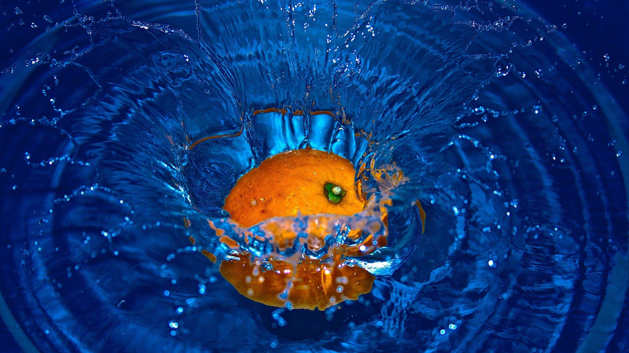 2560x1440 Orange Fruit Splash 4K Wallpaper