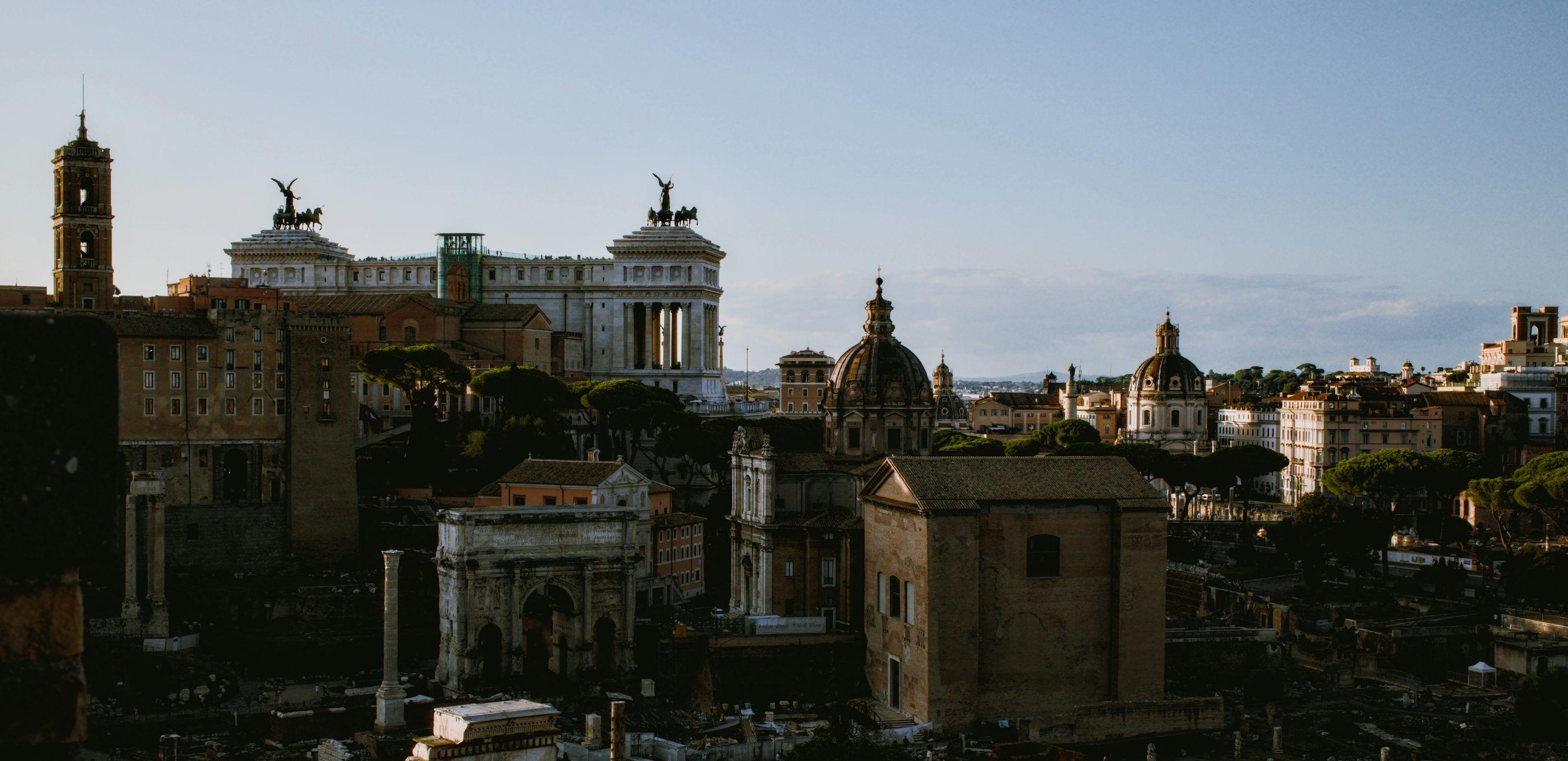 3000x1457 A large building with a clock on top of it photo
