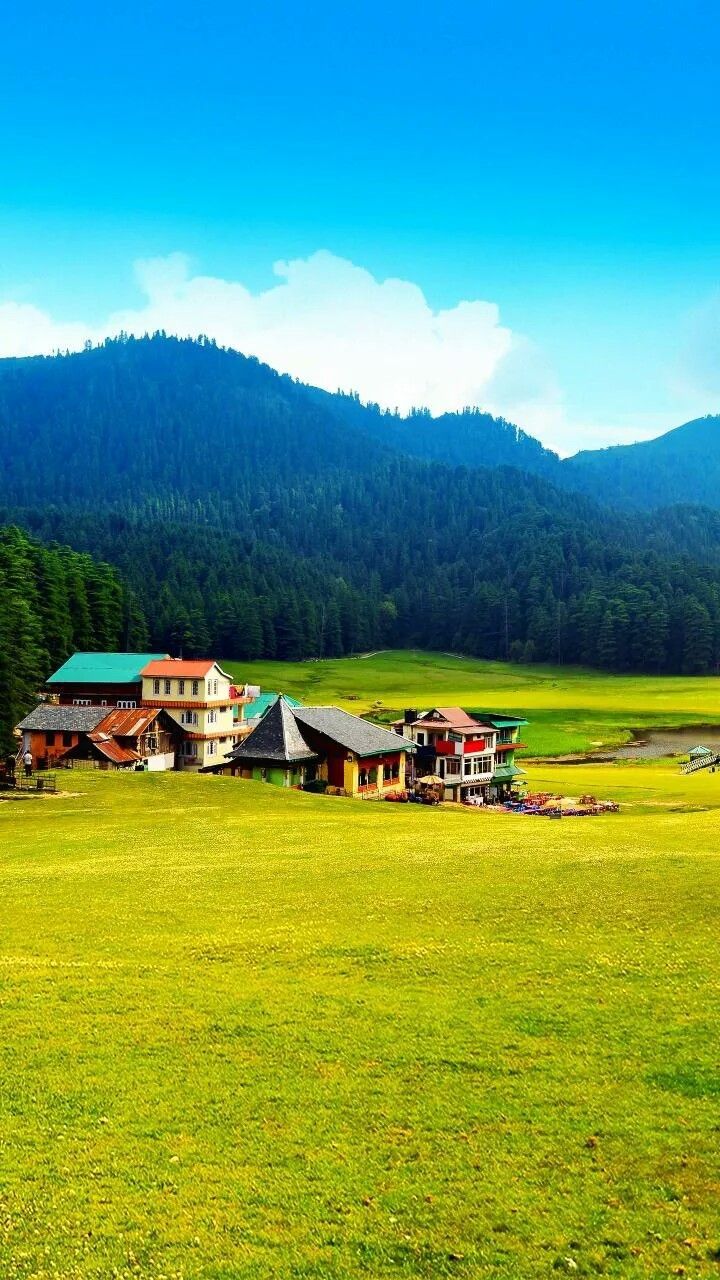 720x1280 Scenic Green Field with Houses and Mountains. Wallpaper for hill station, Pictureque village view, Pakistan scenery wallpaper