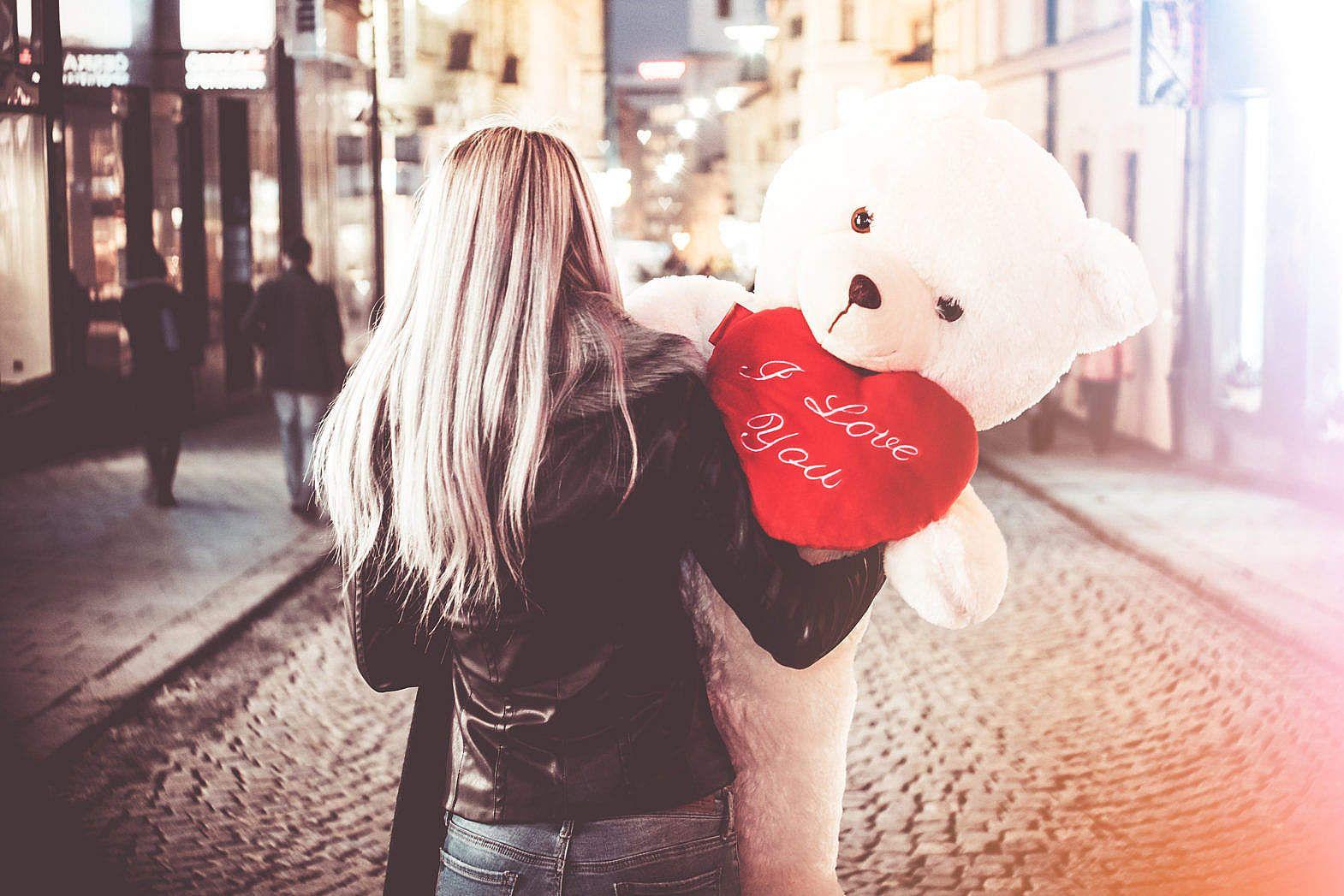 1570x1047 Young Woman Holding Her Big Valentine's Day Gift Teddy Bear Free