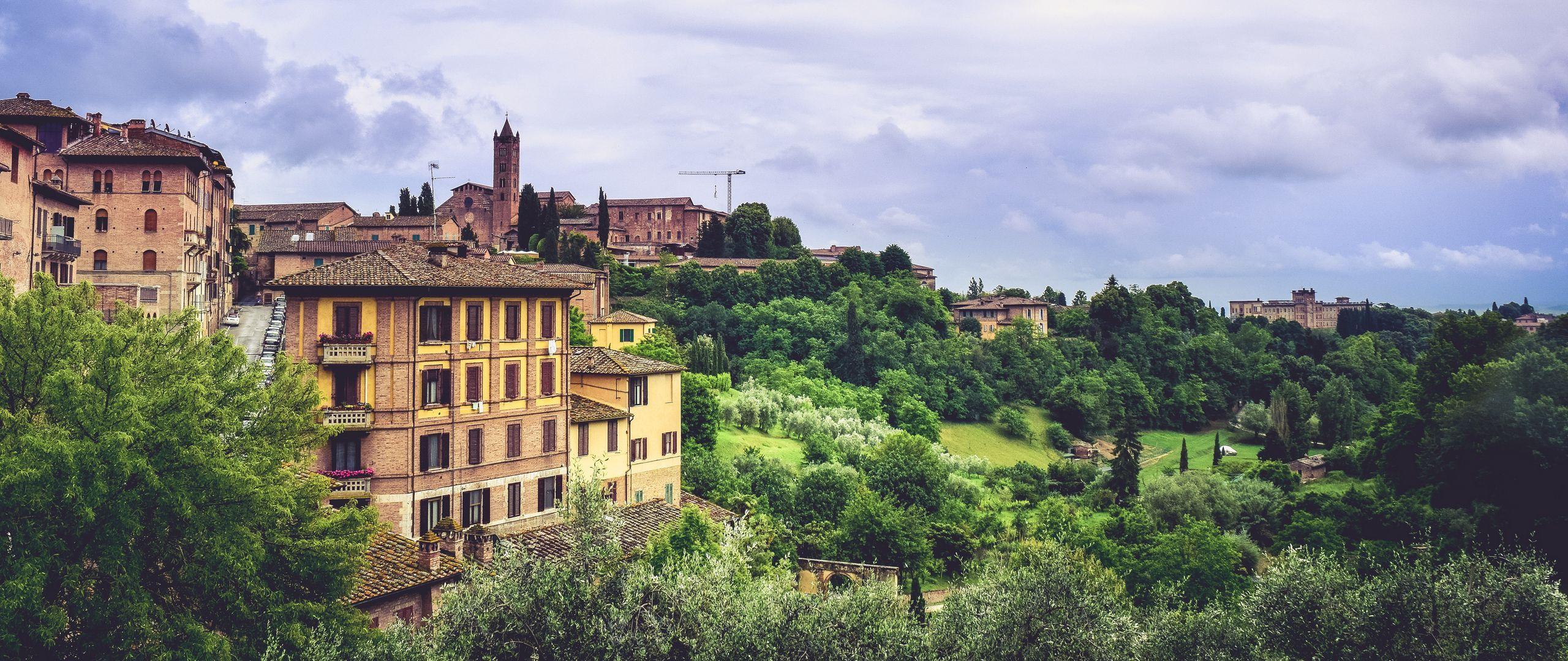 2560x1080 Download wallpaper 2560x1080 siena, italy, province, trees, buildings dual wide 1080p HD background