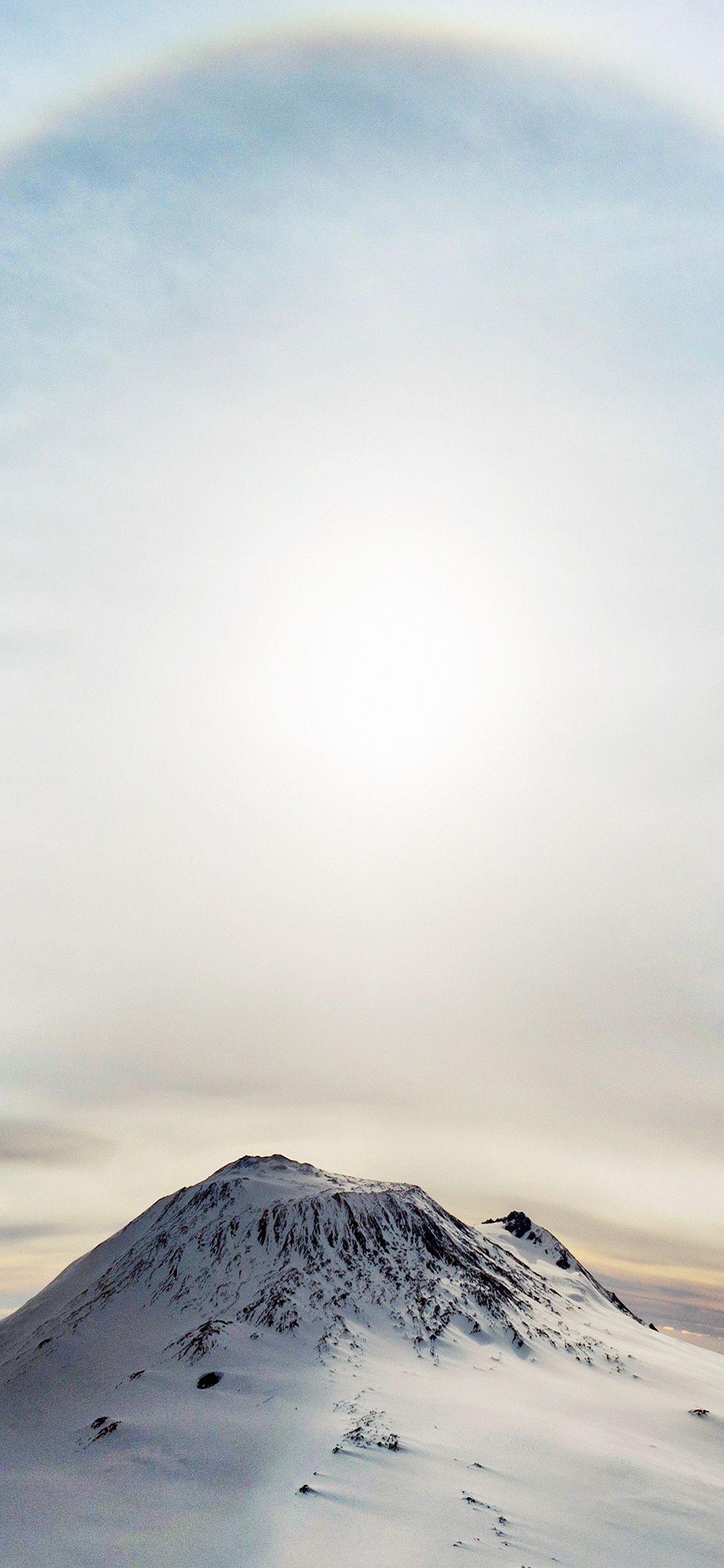 1125x2436 iPhone X wallpaper. mountain wonderful snow winter halo sky white