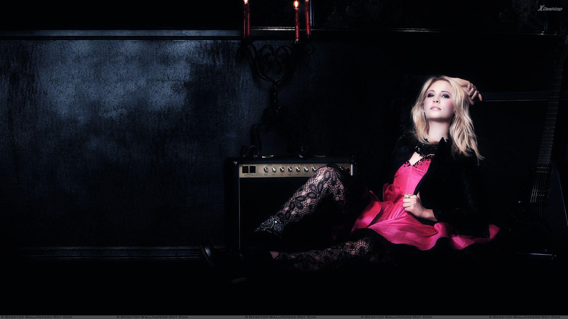 1920x1080 Candice Accola Sitting On A Black Sofa With Guitar Wallpaper
