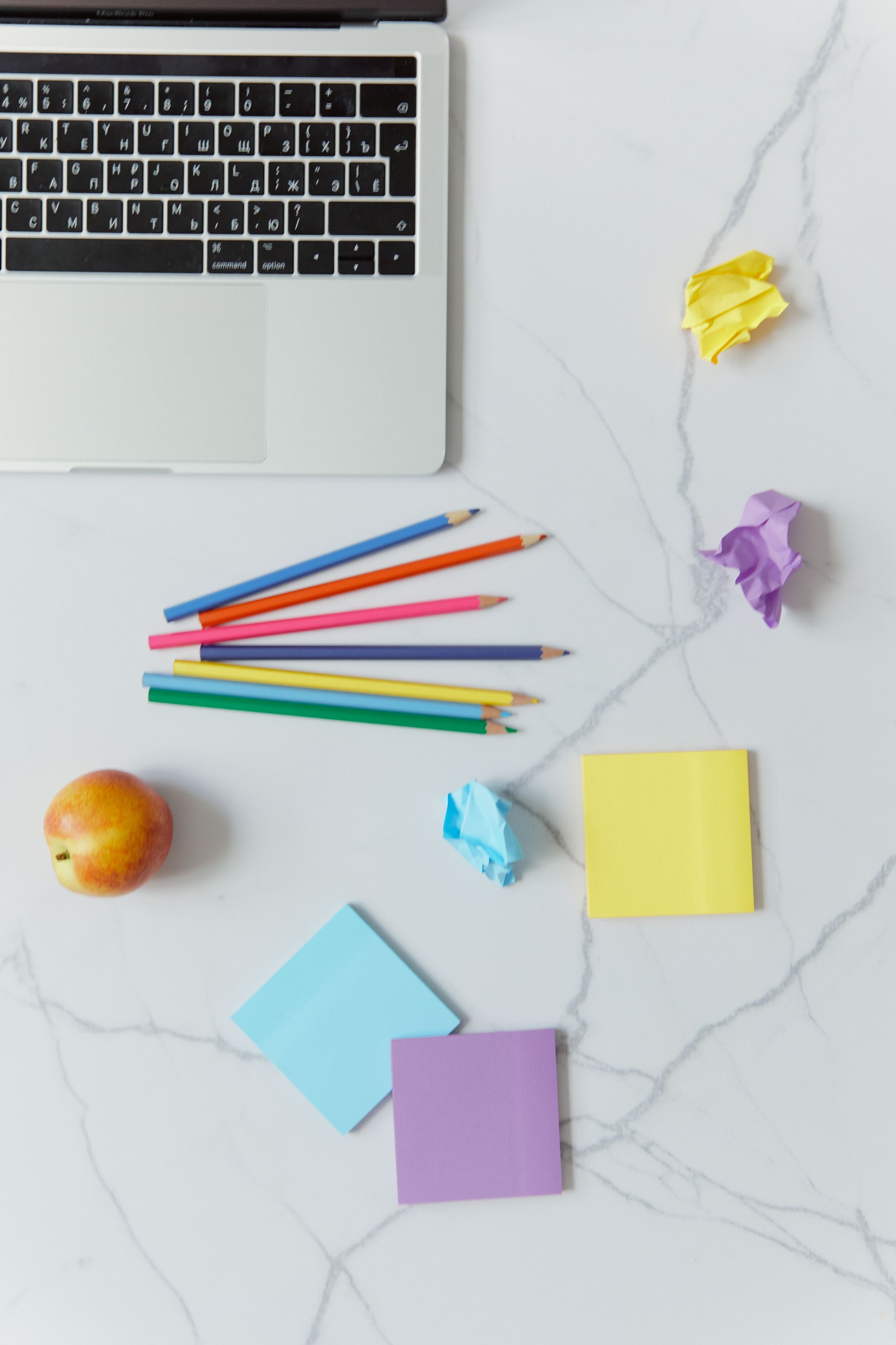 2333x3500 Colorful Stationeries Beside Laptop on a White Surface · Free