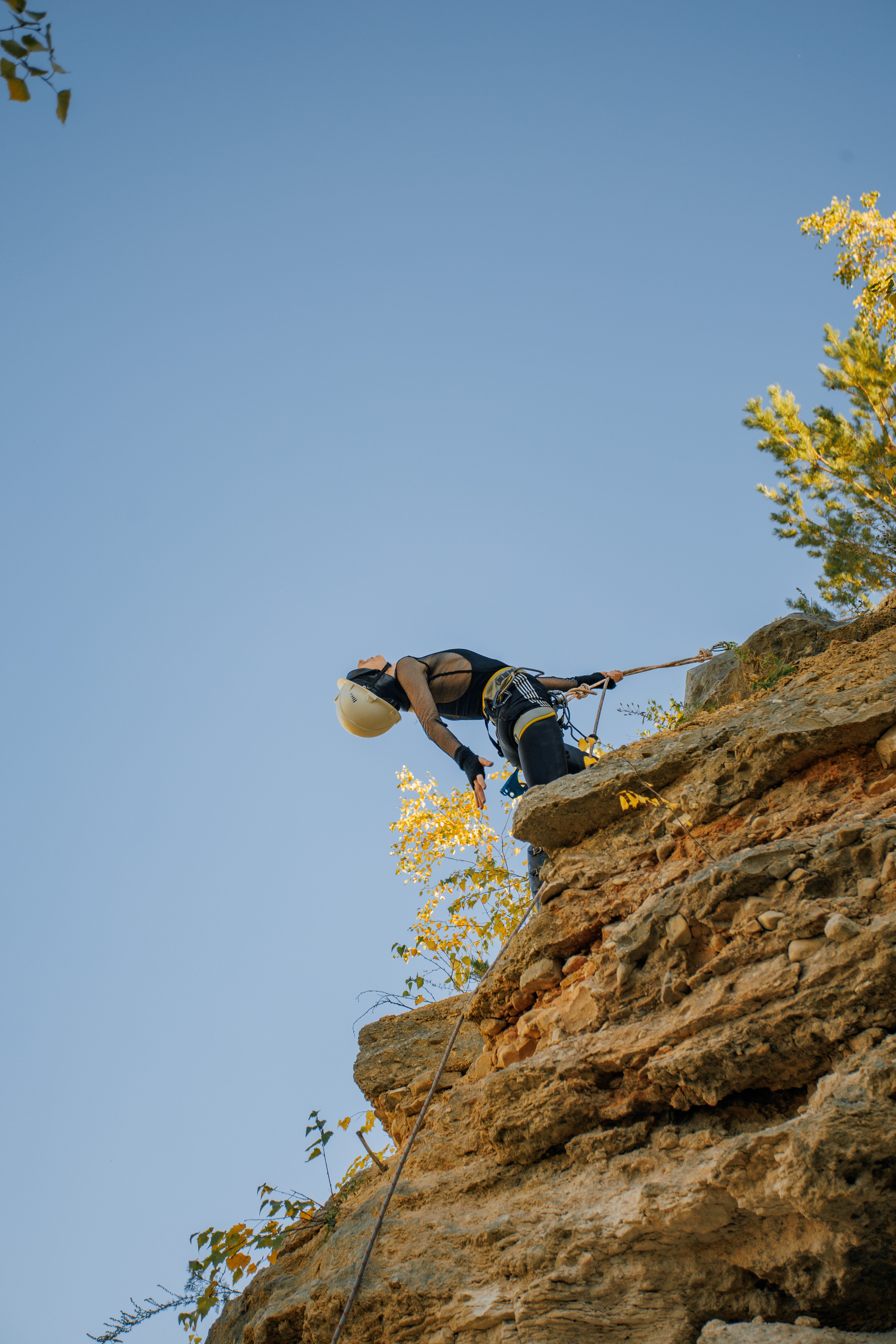 4000x6000 Man Holding Climbing Rope at the Foot of a Rock Face · Free