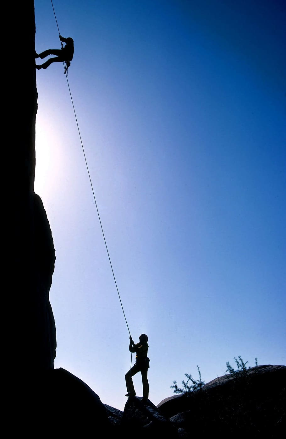 910x1397 750x1334px. free download. HD wallpaper: man climbing using rope near man on the ground looking up, rock climbers
