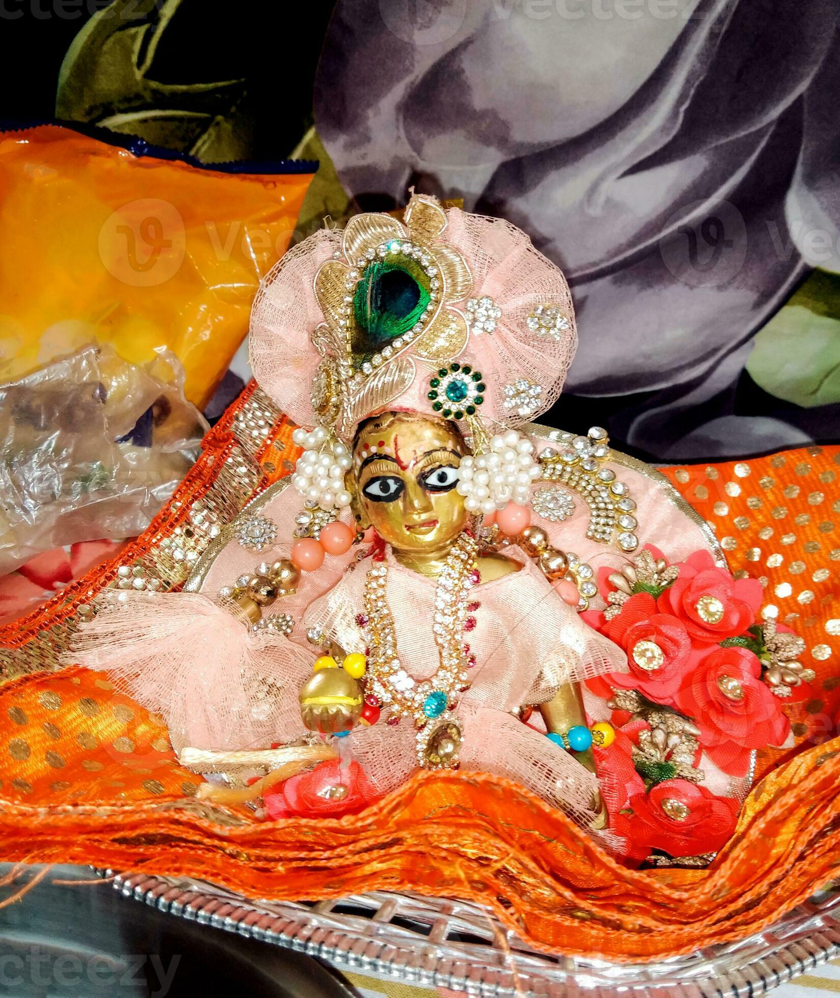 1649x1960 Lord Krishna also known as laddu gopal sculpture in beautiful clothes selective focus