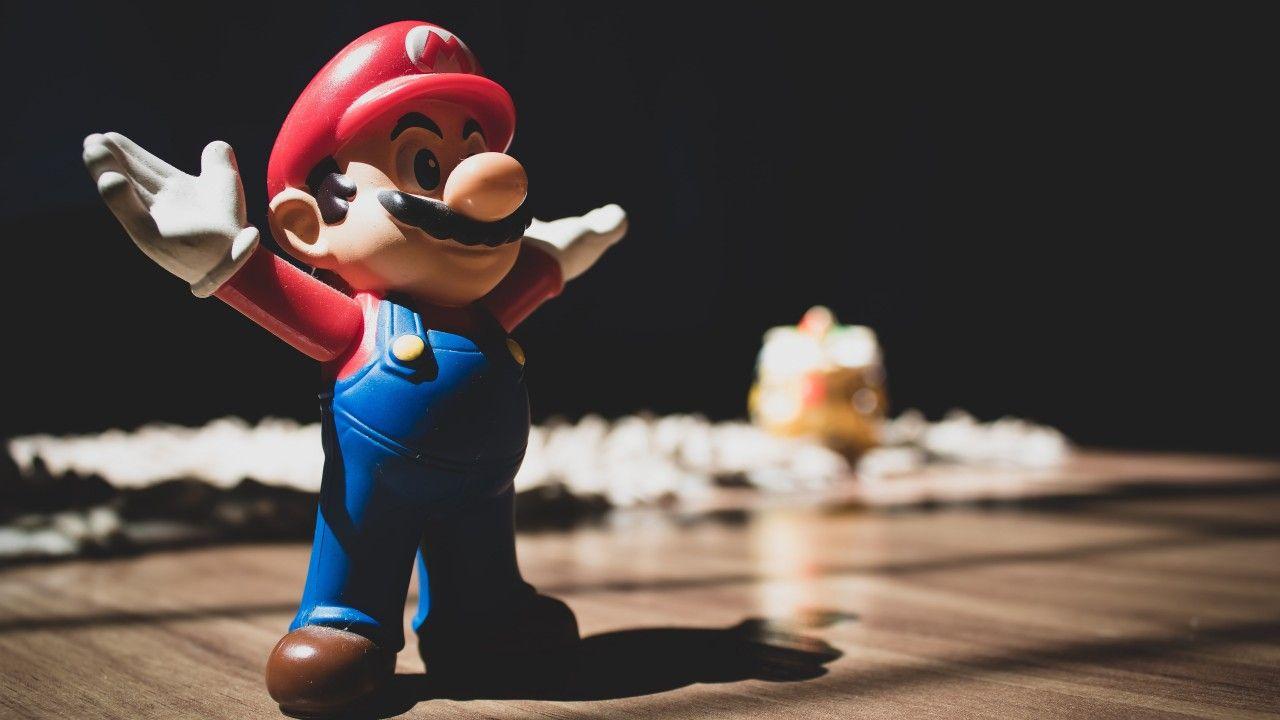 1280x720 3D Super Mario Figurine On Brown Surface 4K 5K HD Wallpaper