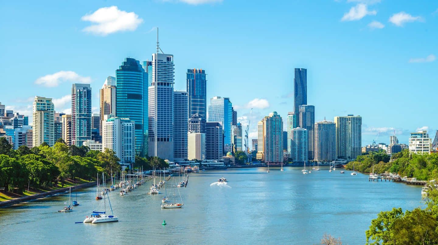 1440x807 Download Caption: Brisbane City Skyline at Night Wallpaper