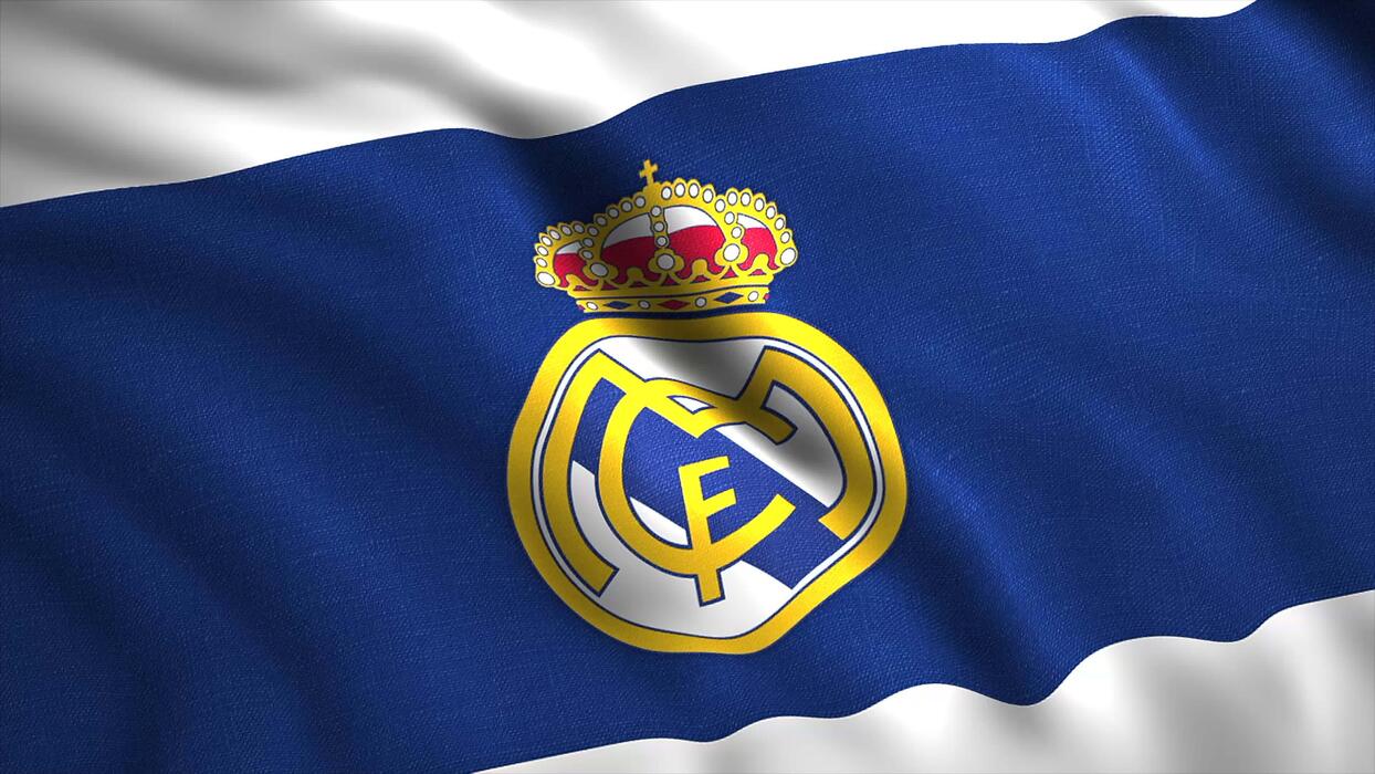 1244x700 The blue flag is the Real Madrid team. Motion.The emblem is recognized by FIFA as the best football club of the twentieth century.Use only for editorial