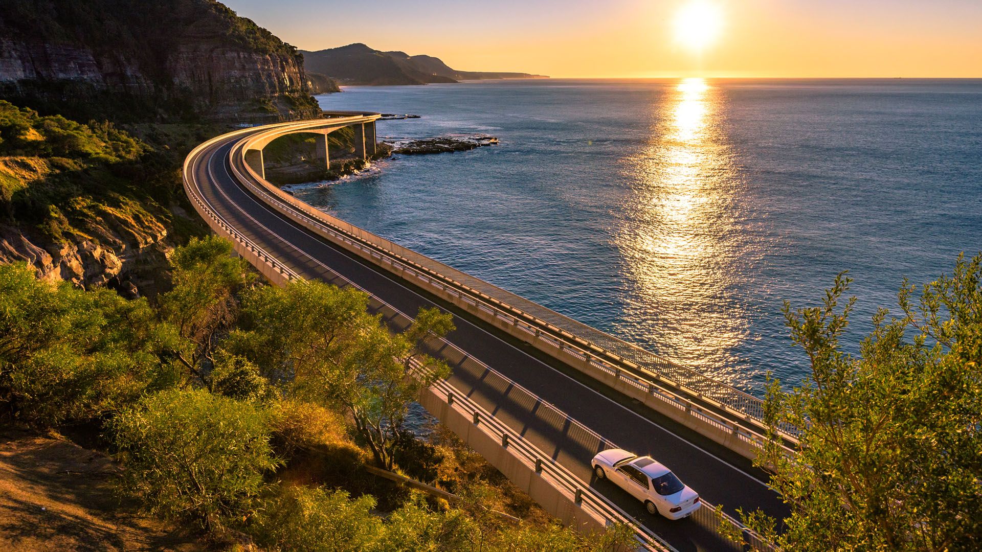 1920x1080 Sunrise over Wollongong Sea Cliff Bridge, Coalcliff, New South Wales, Australia. Windows Spotlight Image