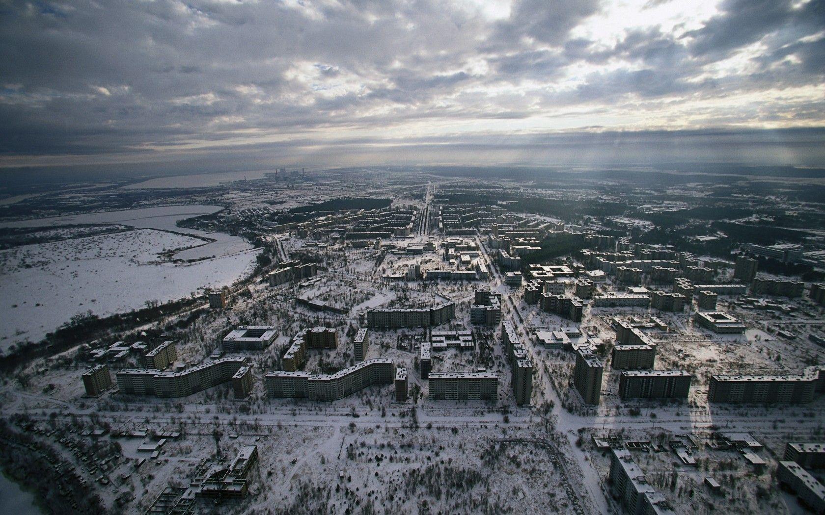 1680x1050 Chernobyl Pripyat Aerial Clouds Snow Winter Buildings Abandon Deserted apocalyptic dark horror nuclear radiation wallpaperx1050