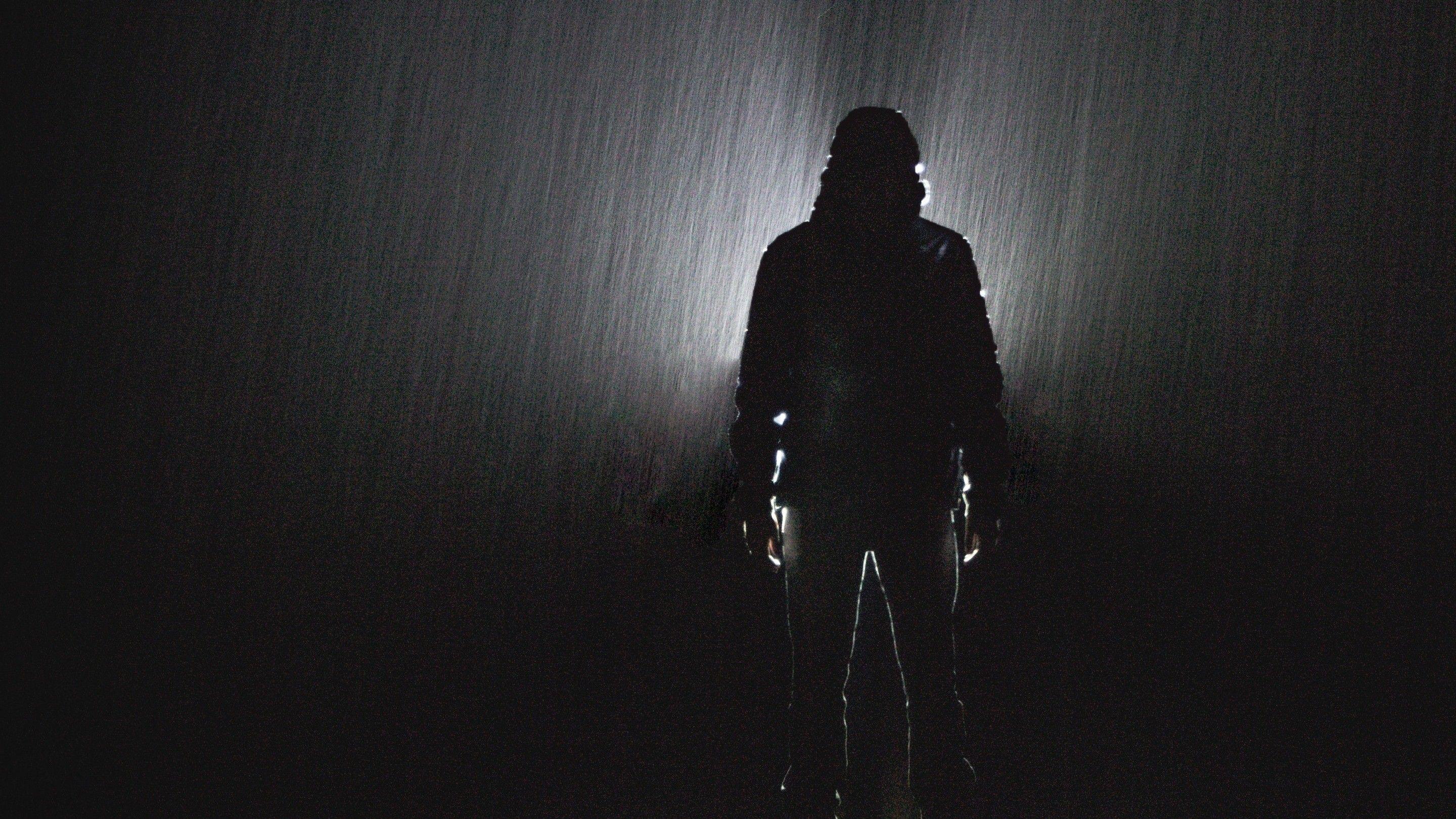 2880x1620 Shadow of Man at Night During Rain Photo