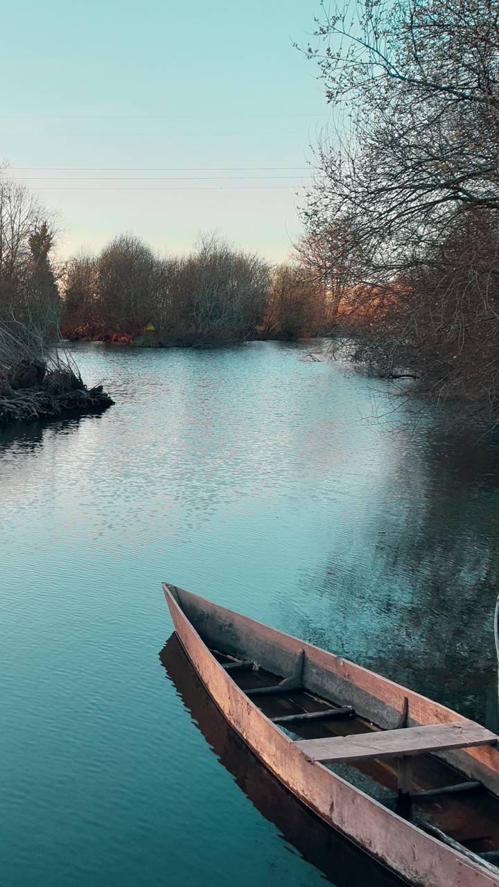 720x1280 River and Canoe wallpaper