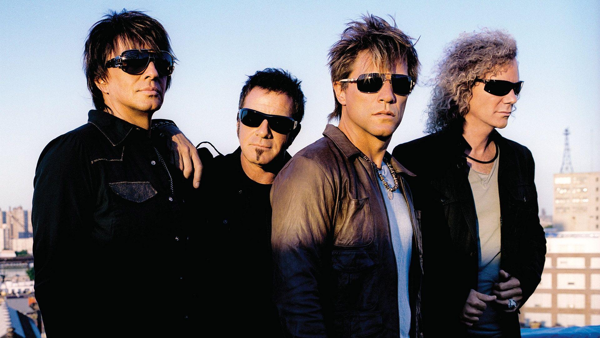 1920x1080 Download Wallpaper 1920x1080 bon jovi, glasses, sunset, city, sky Full HD 1080p HD Background
