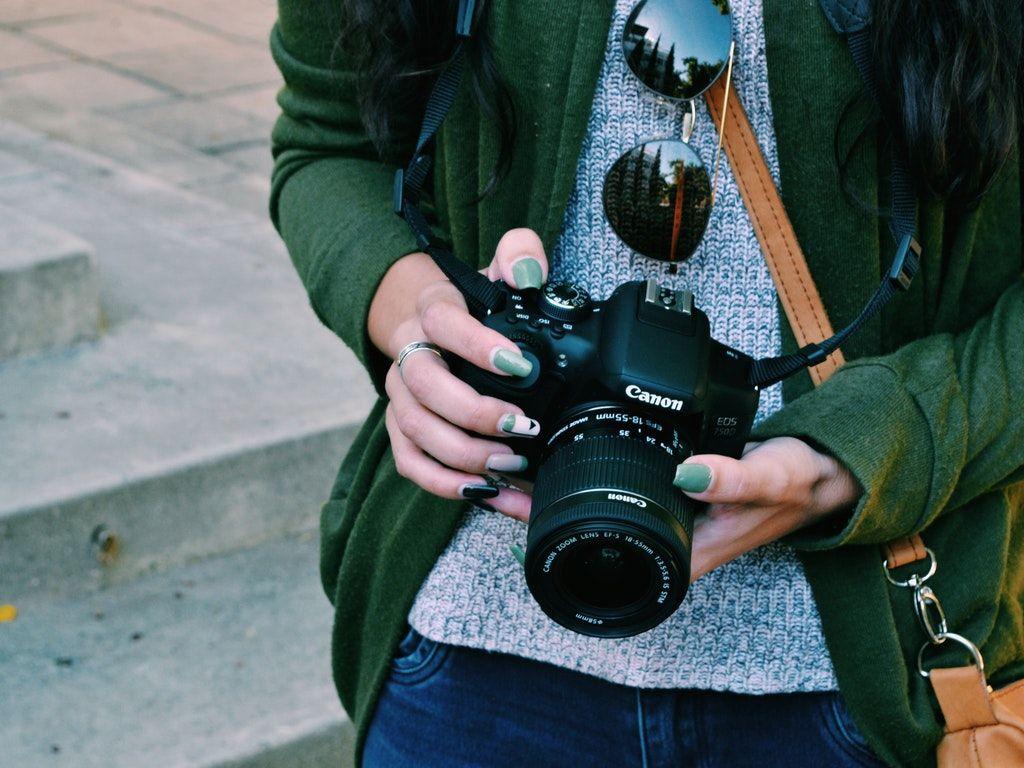 1024x768 Woman Holding Black Canon Dslr Camera HD Wallpaper